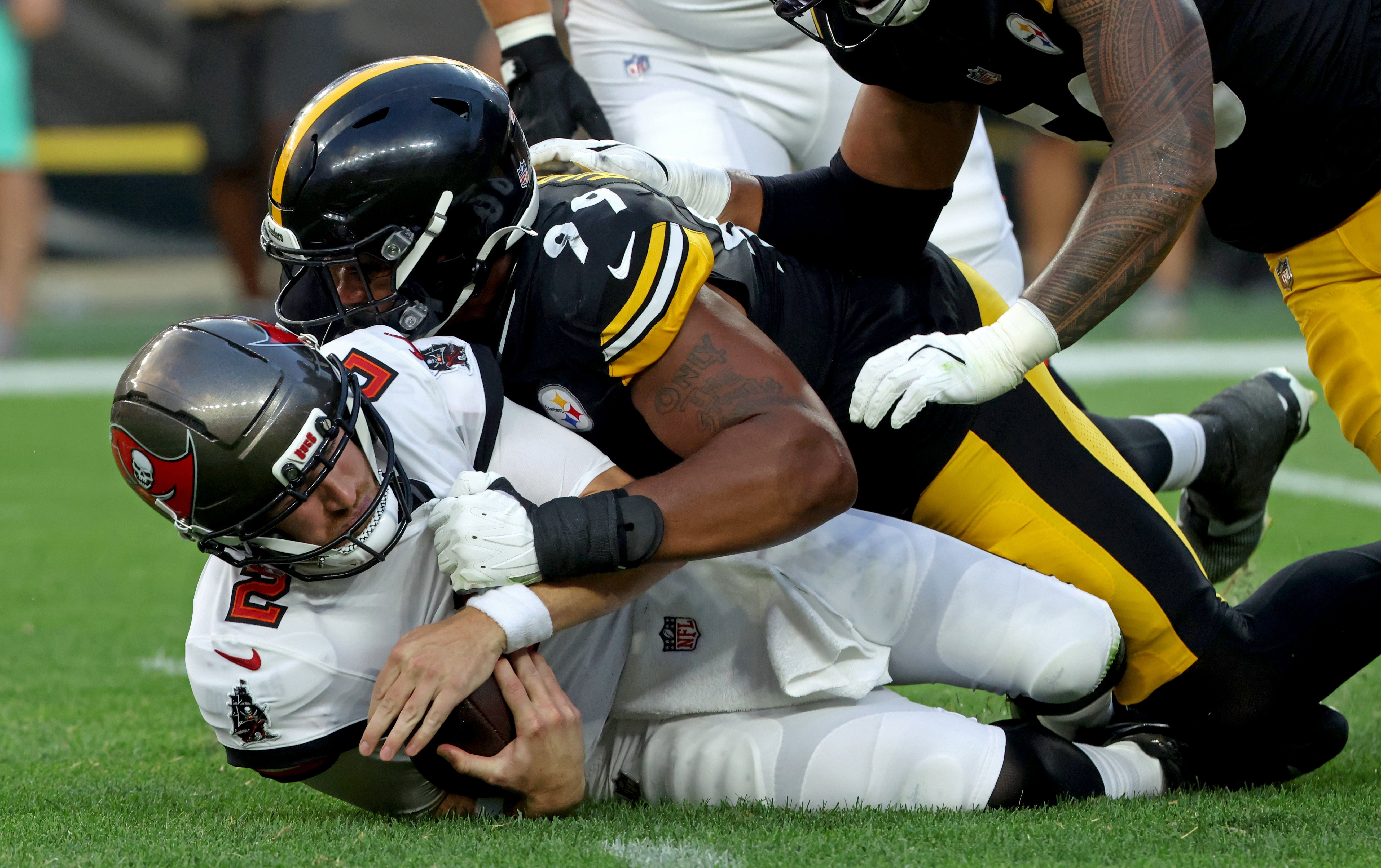 Aug 16, 2025; Pittsburgh, Pennsylvania, USA; Pittsburgh Steelers defensive tackle Derrick Harmon (99) sacks Tampa Bay Buccaneers quarterback Kyle Trask (2) during the first quarter at Acrisure Stadium.