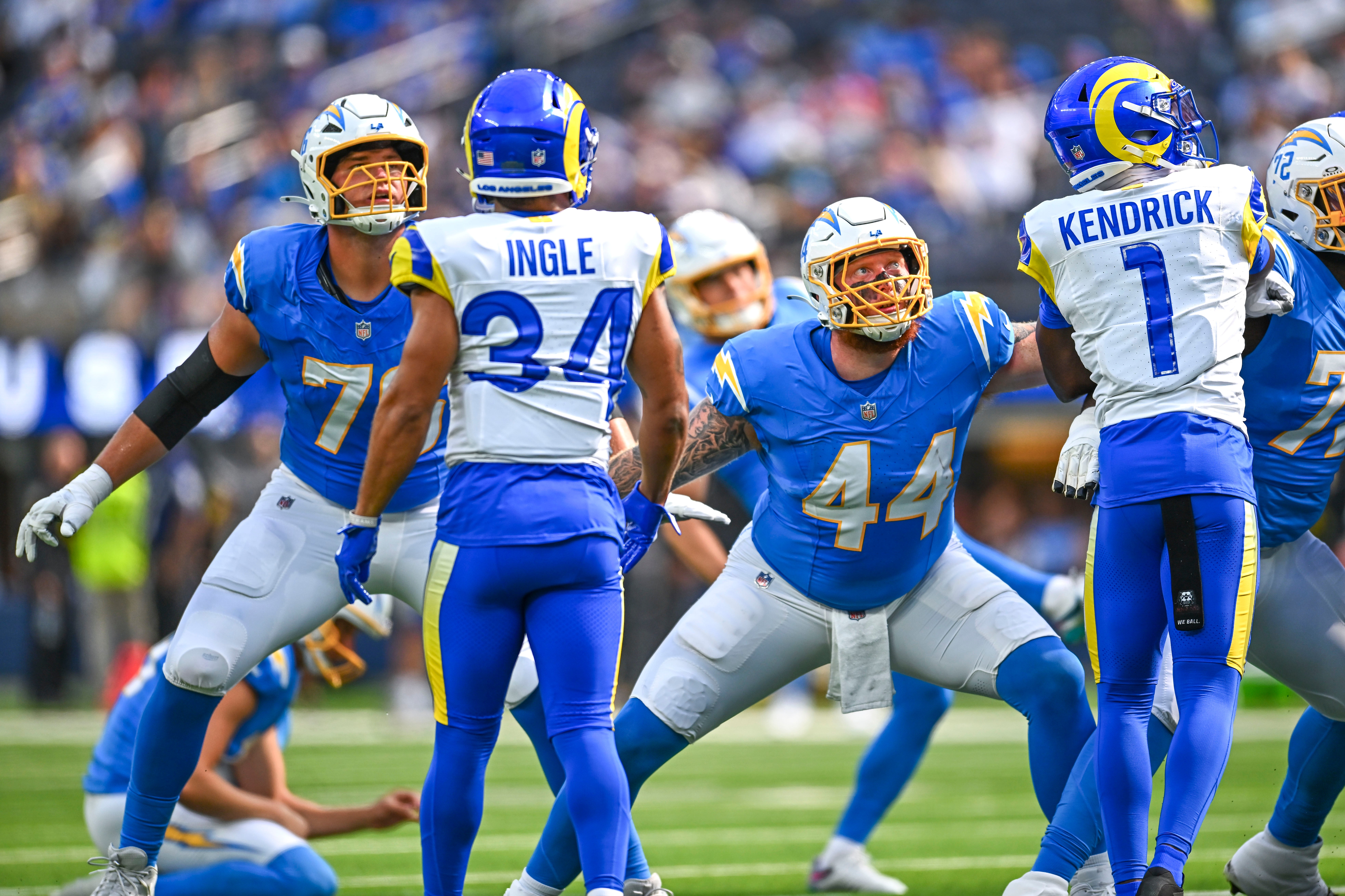Aug 16, 2025; Inglewood, California, USA; Los Angeles Chargers fullback Scott Matlock (44) and offensive tackle Joe Alt (76) watch a field goal kick against Los Angeles Rams safety Tanner Ingle (34) and cornerback Derion Kendrick (1) during the first quarter at SoFi Stadium. Mandatory Credit: Jonathan Hui-Imagn Images