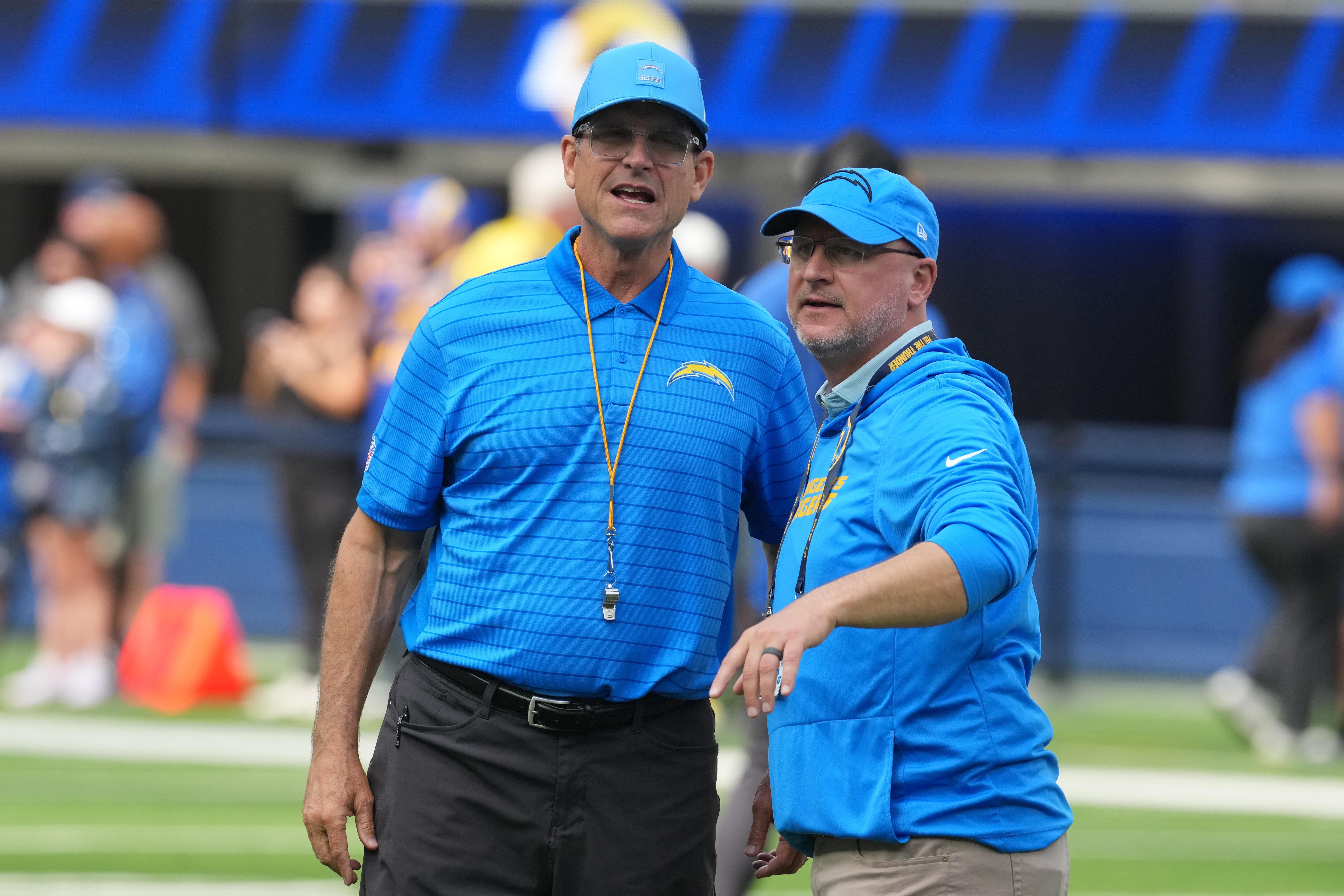 Chargers GM Joe Hortiz and head coach Jim Harbaugh