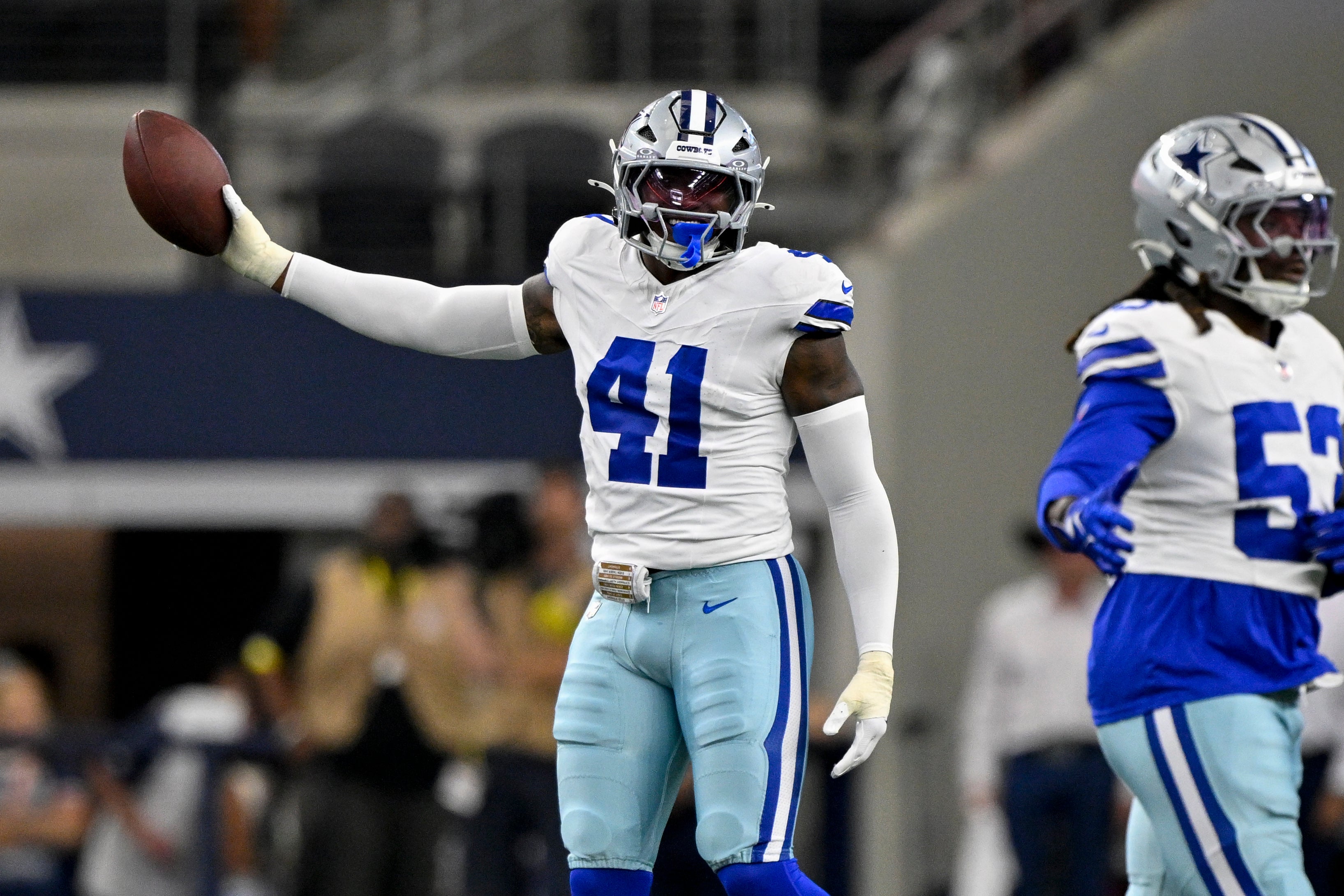 Aug 16, 2025; Arlington, Texas, USA; Dallas Cowboys defensive end Donovan Ezeiruaku (41) celebrates during the game between the Dallas Cowboys and the Baltimore Ravens at AT&T Stadium.