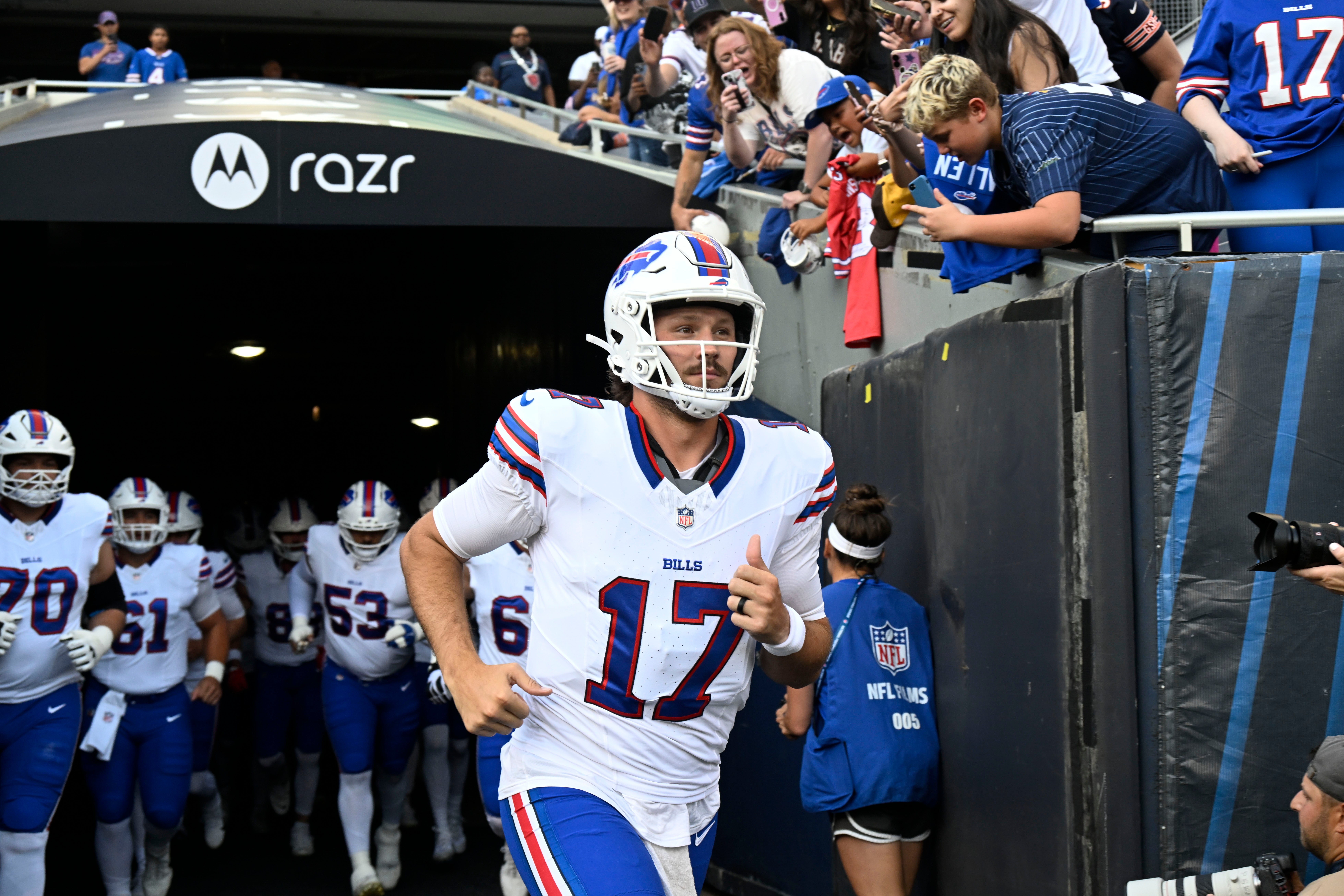 Aug 17, 2025; Chicago, Illinois, USA; Buffalo Bills quarterback Josh Allen (17) leads the team during warmups before a preseason game against the Chicago Bears at Soldier Field.