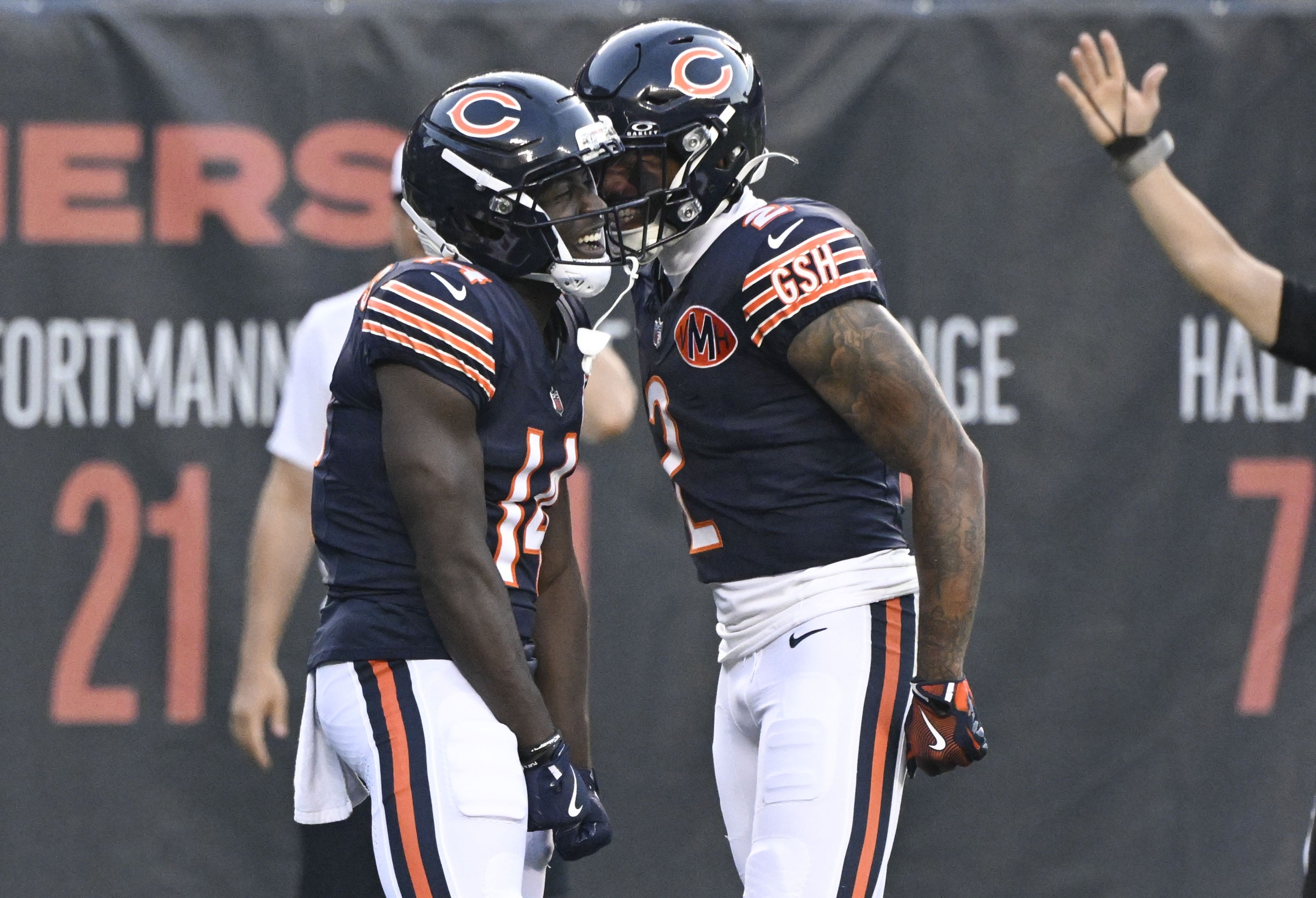 Aug 17, 2025; Chicago, Illinois, USA; Chicago Bears wide receiver Olamide Zaccheaus (14) celebrates with wide receiver DJ Moore (2) after scoring a touchdown against the Buffalo Bills during the first half at Soldier Field.