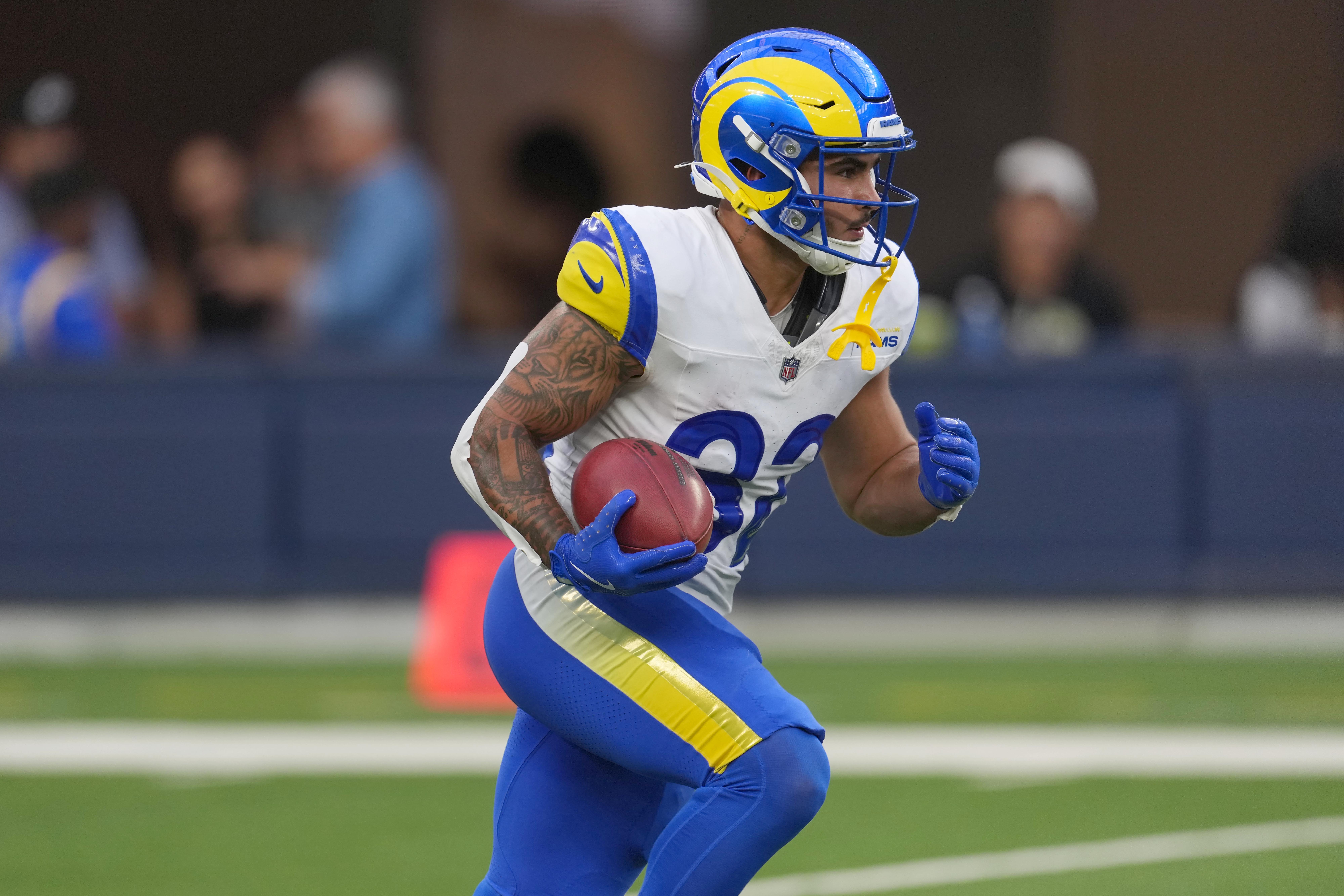 Los Angeles Rams running back Cody Schrader (32) carries the ball against the Los Angeles Chargers in the second half at SoFi Stadium.