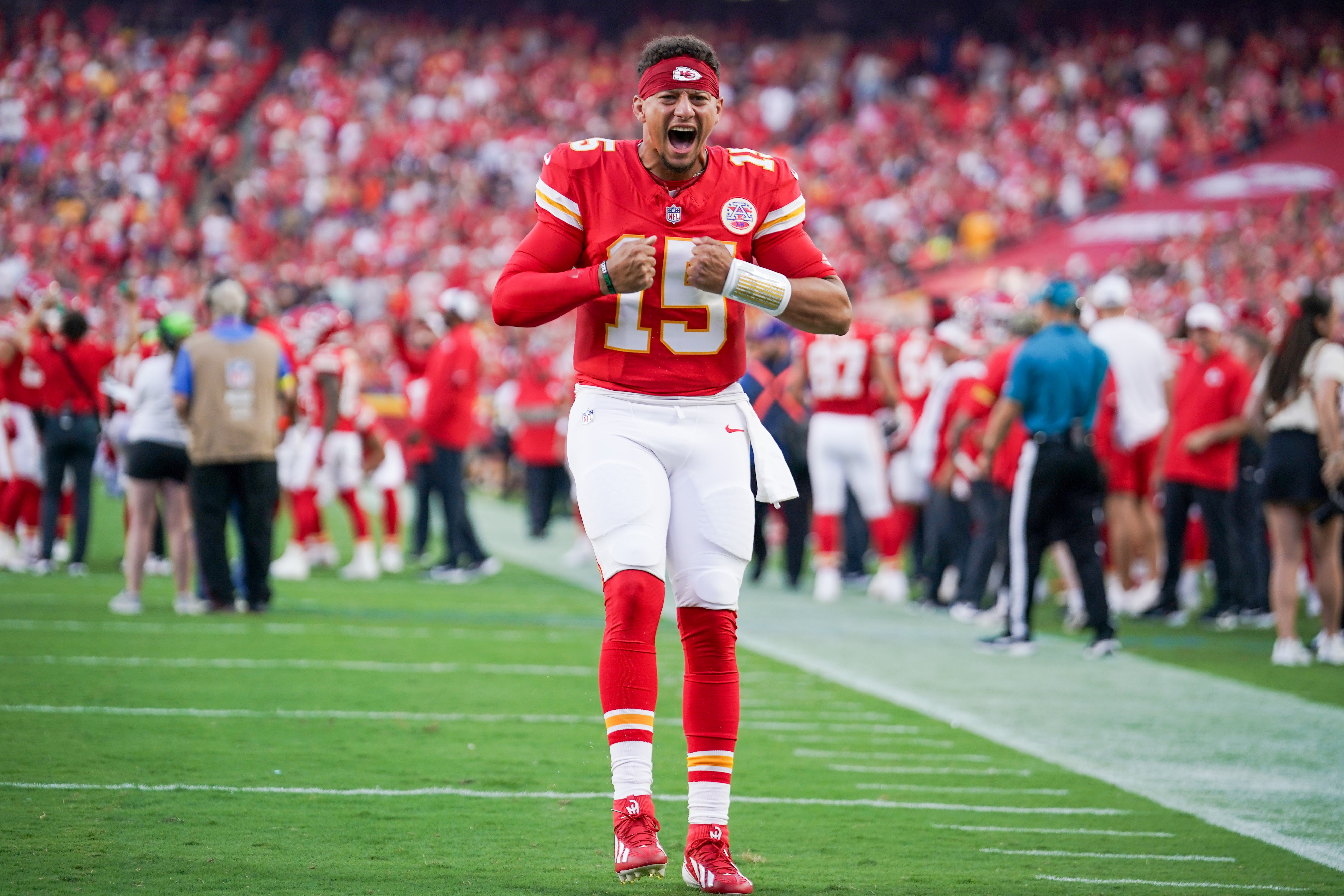 Kansas City Chiefs quarterback Patrick Mahomes (15) celebrates toward fans against the Chicago Bears during the first half of the game at GEHA Field at Arrowhead Stadium.