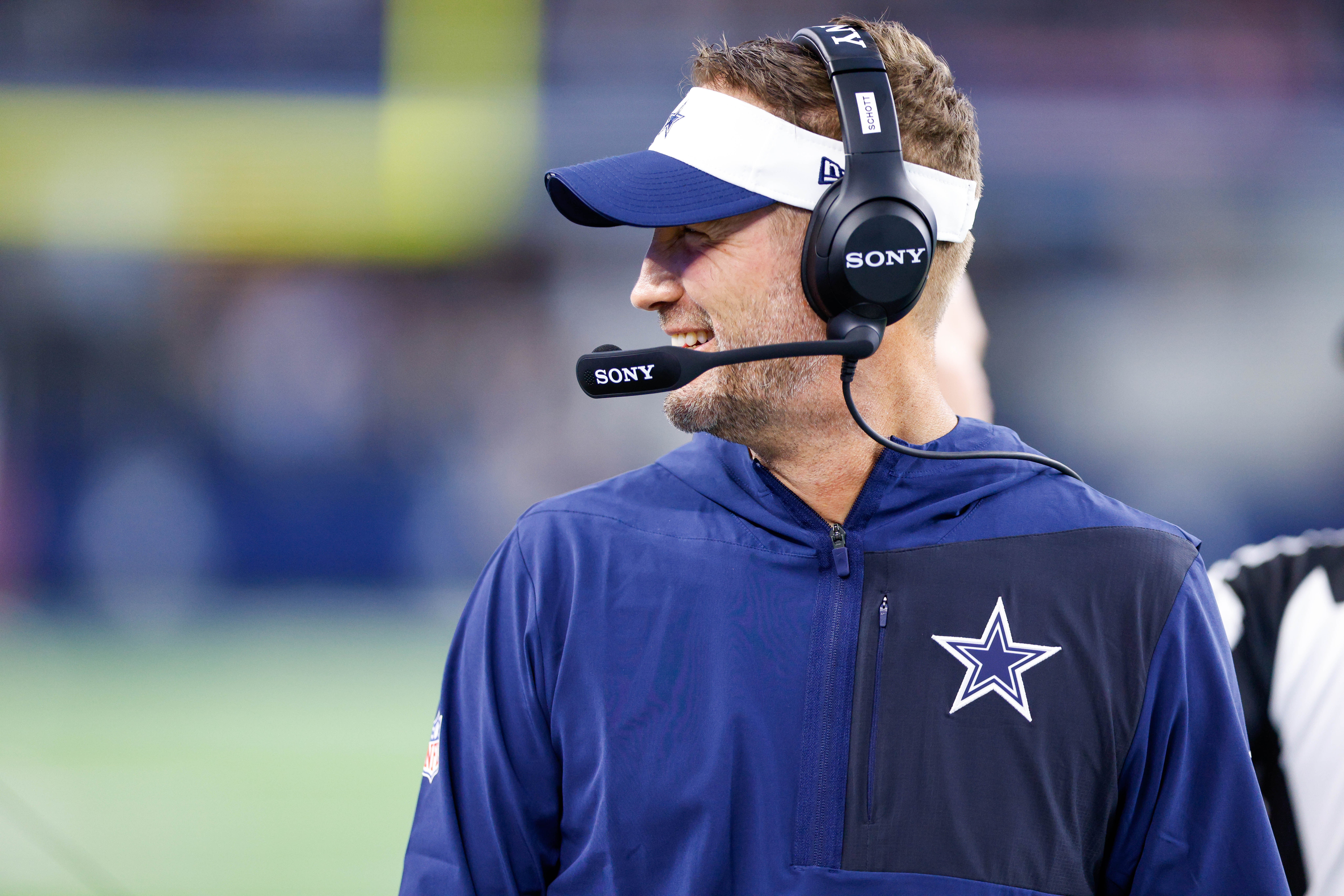 Dallas Cowboys head coach Brian Schottenheimer smiles during the first quarter against the Atlanta Falcons at AT&T Stadium.