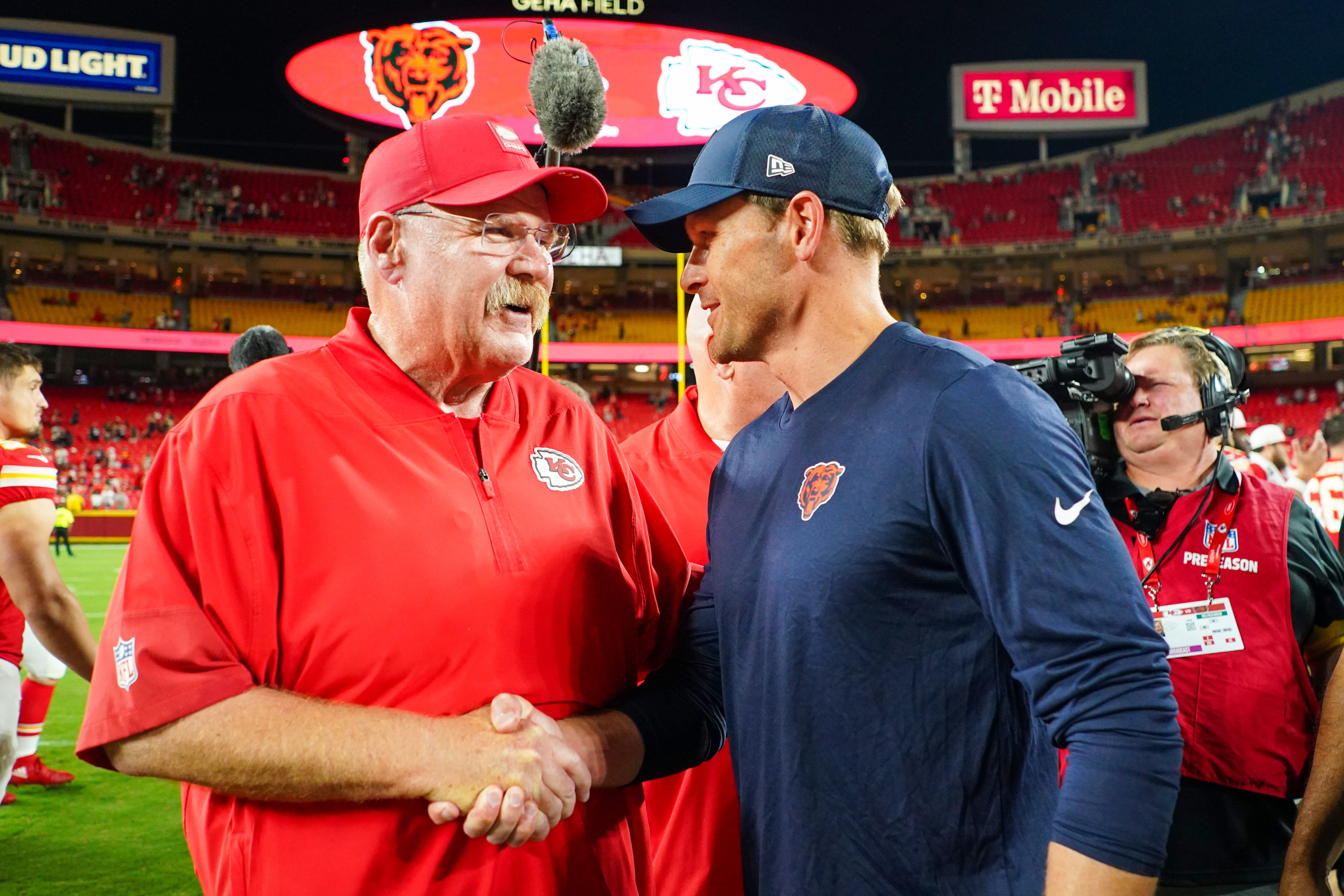 Aug 22, 2025; Kansas City, Missouri, USA; Kansas City Chiefs head coach Andy Reid shakes hands with Chicago Bears head coach Ben Johnson after the game at GEHA Field at Arrowhead Stadium.
