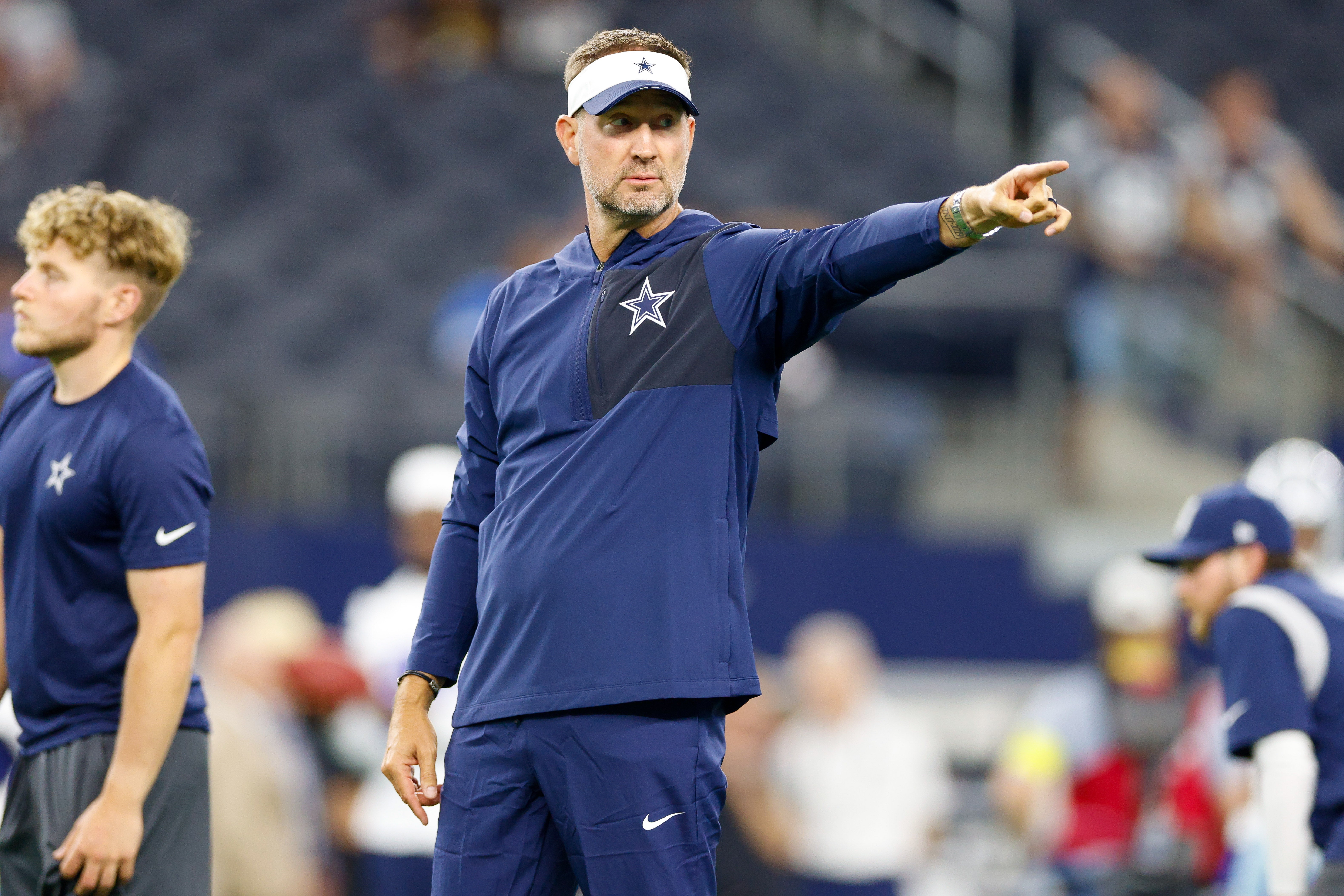 Dallas Cowboys head coach Brian Schottenheimer gives directions prior to the game against the Atlanta Falcons at AT&T Stadium.