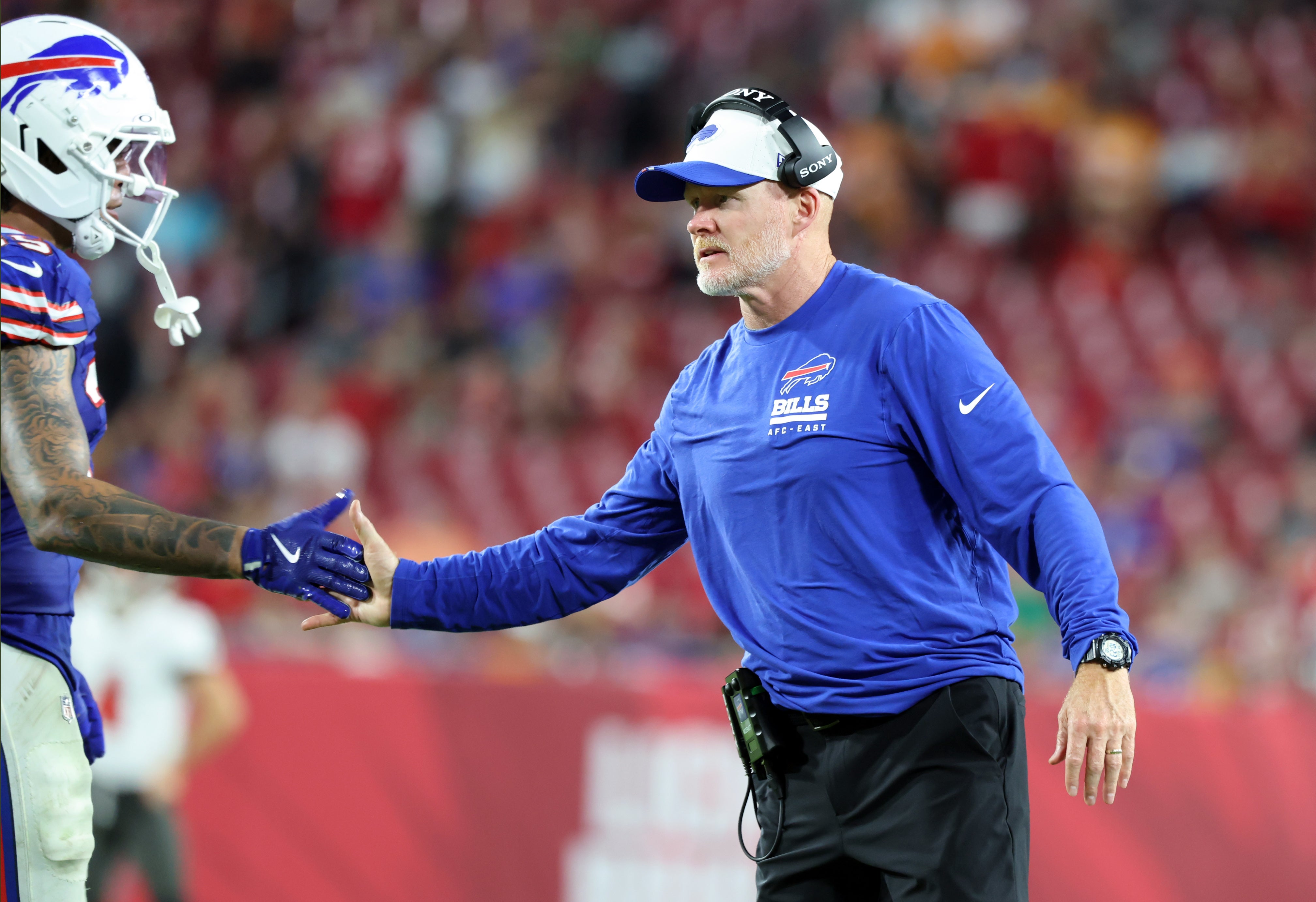 Aug 23, 2025; Tampa, Florida, USA; Buffalo Bills head coach Sean McDermott high fives teammates against the Tampa Bay Buccaneers during the second half at Raymond James Stadium.