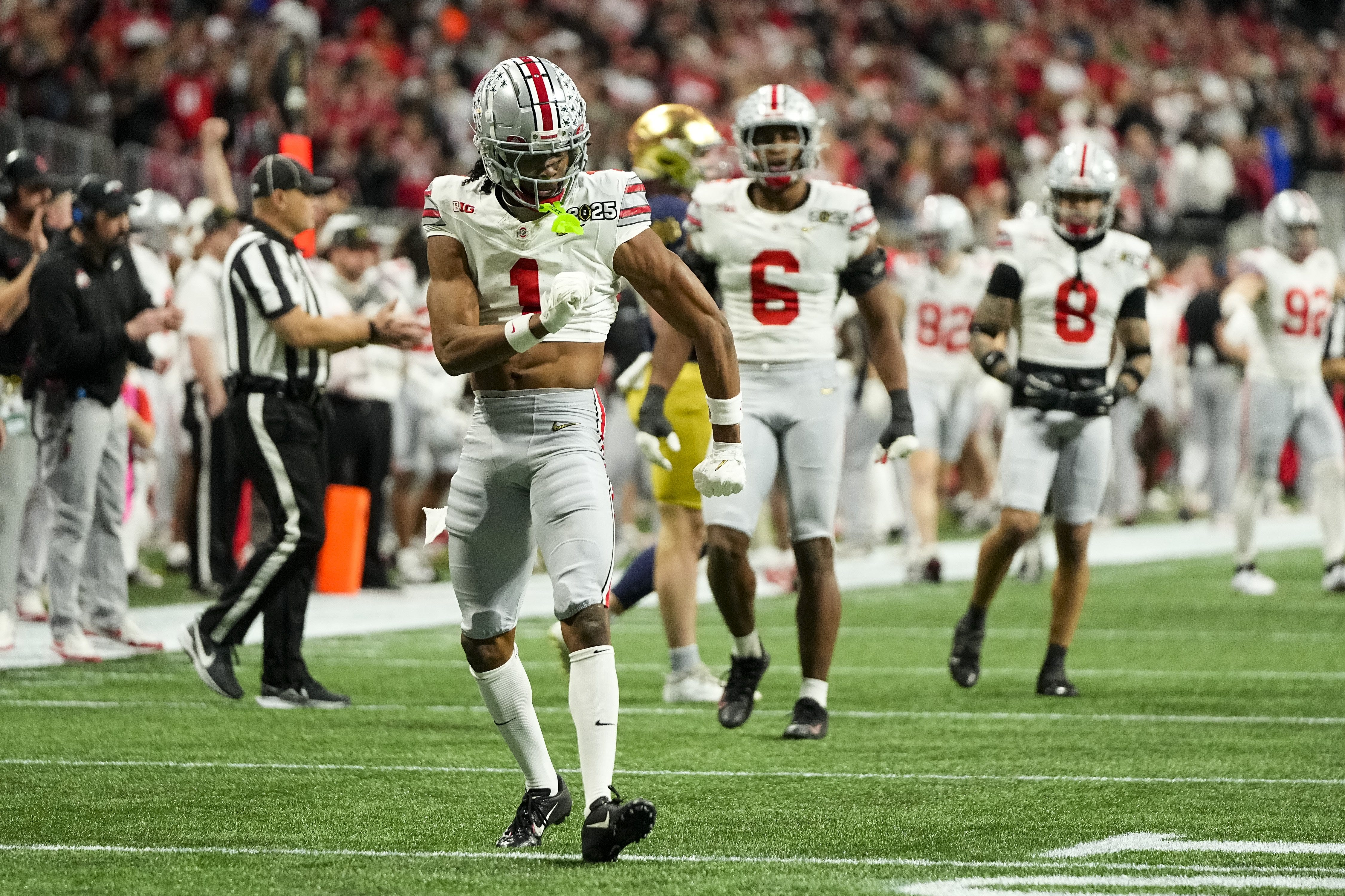 Ohio State Buckeyes cornerback Davison Igbinosun (1) celebrates a stop during the College Football Playoff National Championship against the Notre Dame Fighting Irish at Mercedes-Benz Stadium in Atlanta on Jan. 22, 2025.