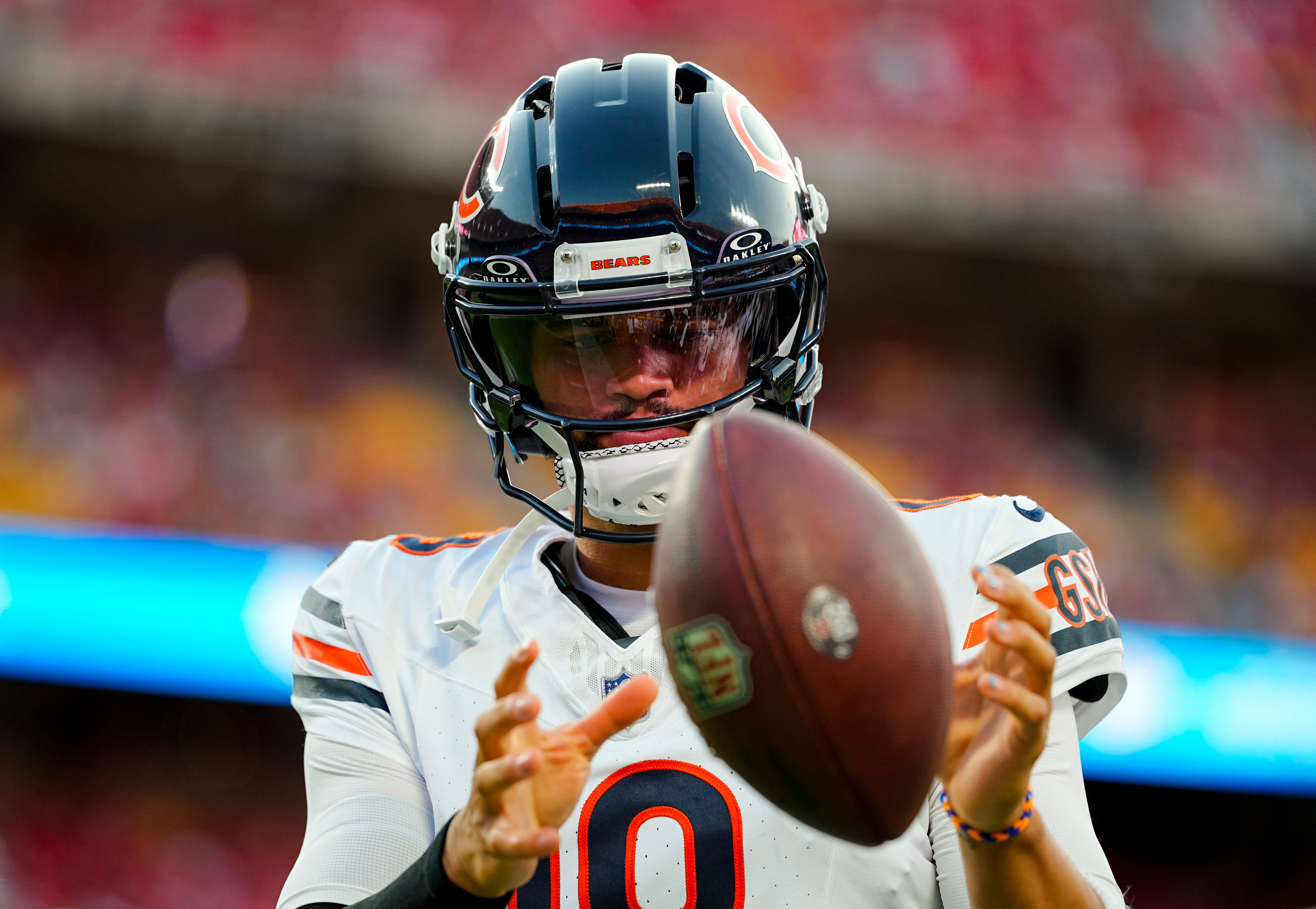 Aug 22, 2025; Kansas City, Missouri, USA; Chicago Bears quarterback Caleb Williams (18) warms up during the first half against the Kansas City Chiefs at GEHA Field at Arrowhead Stadium.