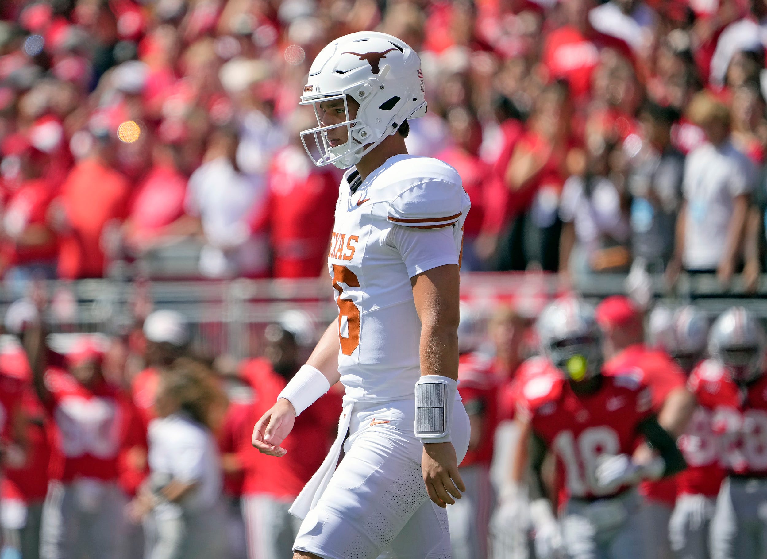 Texas Longhorns quarterback Arch Manning (16) walks back the team huddle against Ohio State Buckeyes in the first quarter of their game at Ohio Stadium in Columbus, Ohio on Aug 30, 2025.