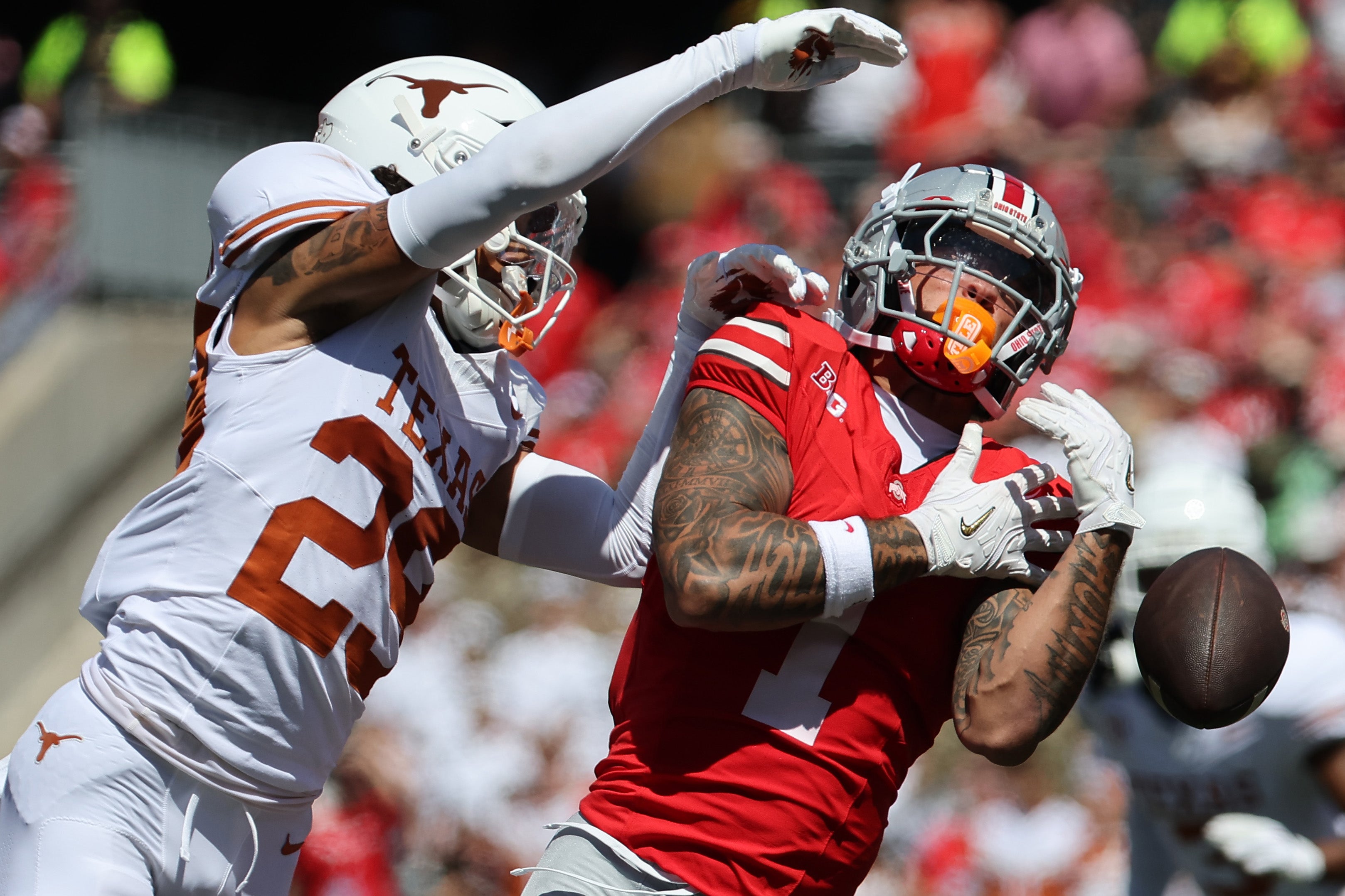Aug 30, 2025; Columbus, Ohio, USA; Ohio State Buckeyes wide receiver Brandon Inniss (1) attempts to make a catch over Texas Longhorns defensive back Graceson Littleton (29) in the first half at Ohio Stadium.