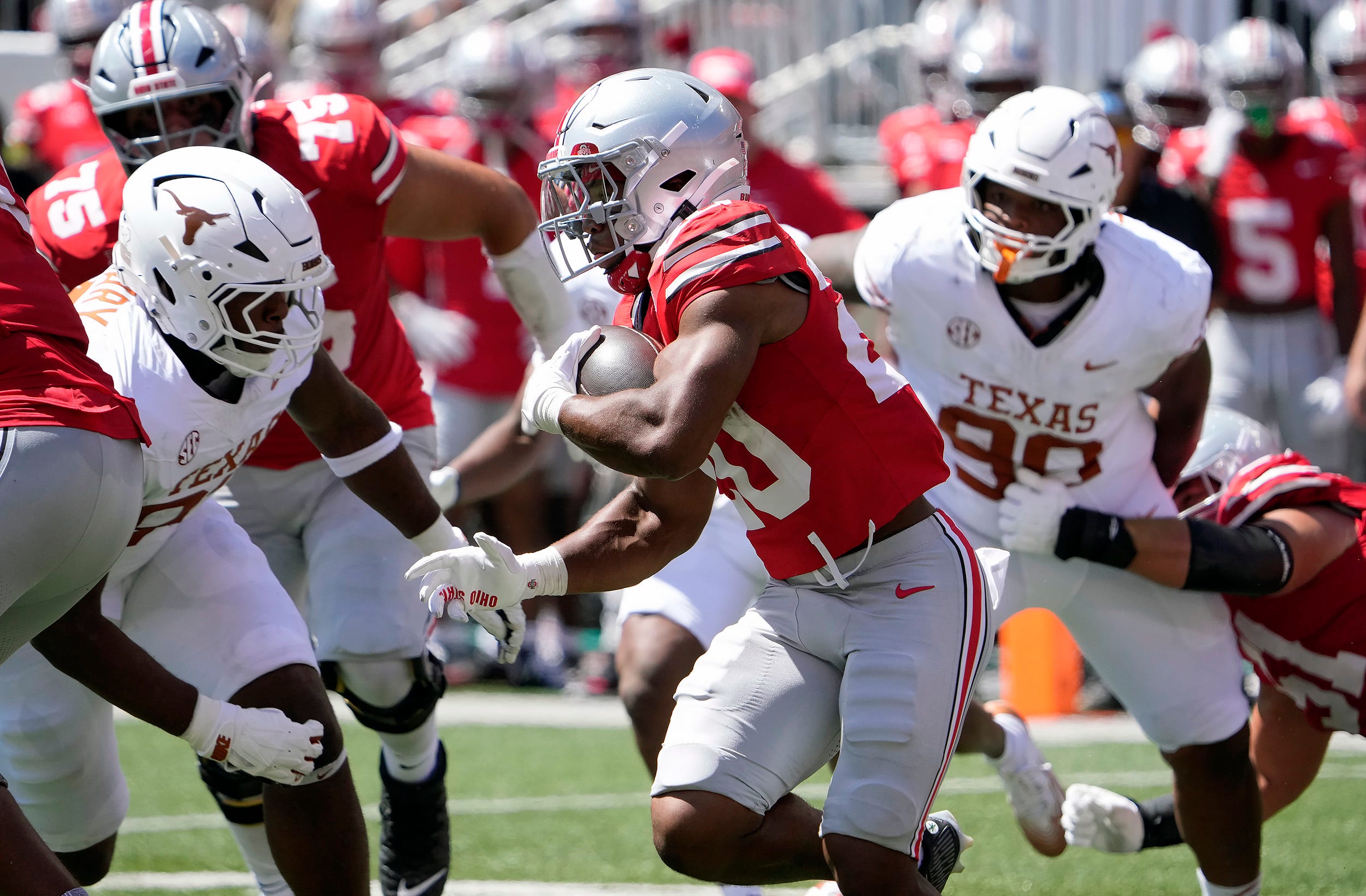 Ohio State Buckeyes running back James Peoples (20) runs the ball against Texas Longhorns in the second quarter of their game at Ohio Stadium in Columbus, Ohio on Aug 30, 2025.