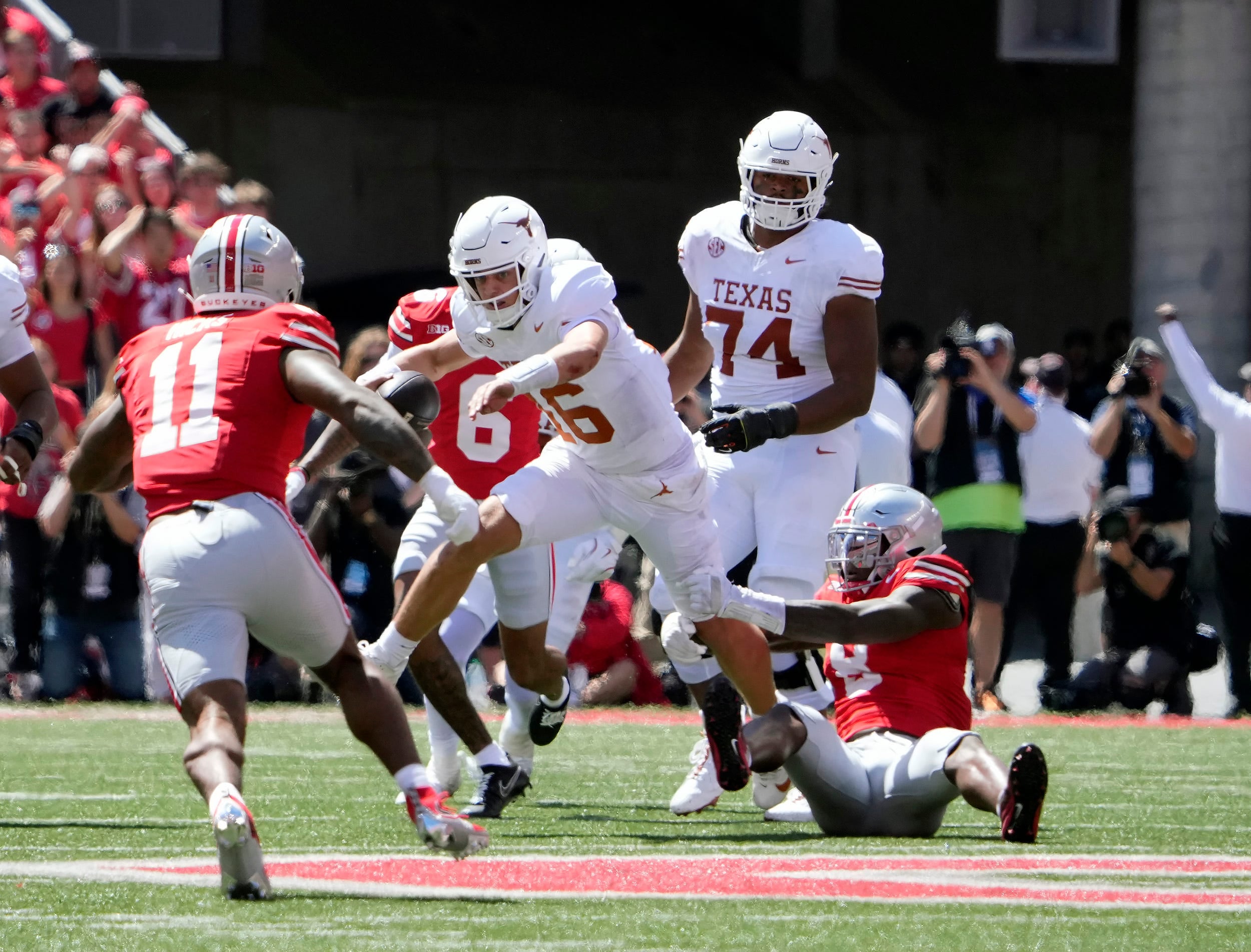 Aug 30, 2025; Columbus, Ohio, USA; Ohio State Buckeyes linebacker Arvell Reese (8) tackles Texas Longhorns quarterback Arch Manning (16) in the second quarter at Ohio Stadium.