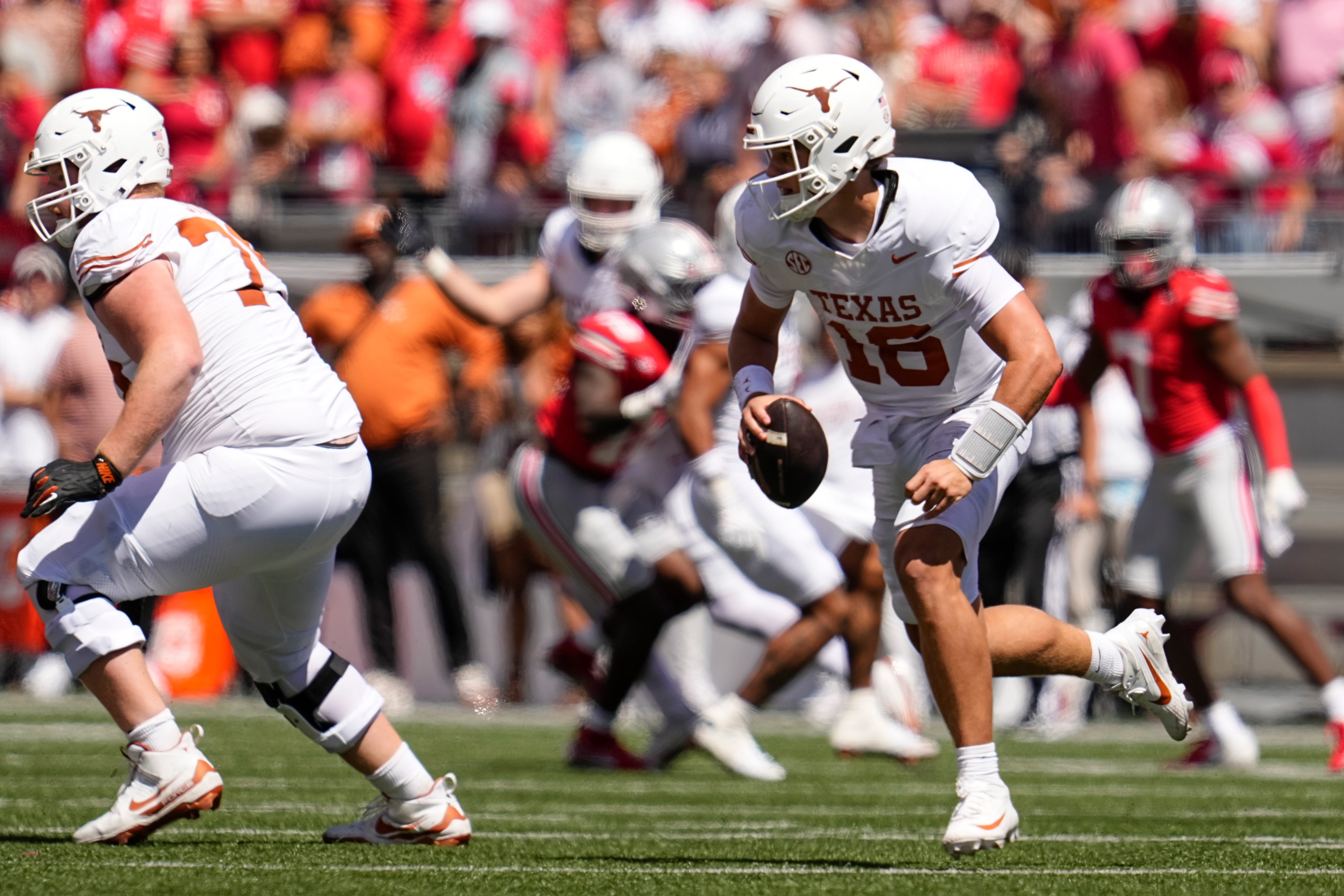 Texas Longhorns quarterback Arch Manning (16) runs during the second half of the NCAA football game against the Ohio State Buckeyes at Ohio Stadium on Aug. 30, 2025. Ohio State won 14-7.