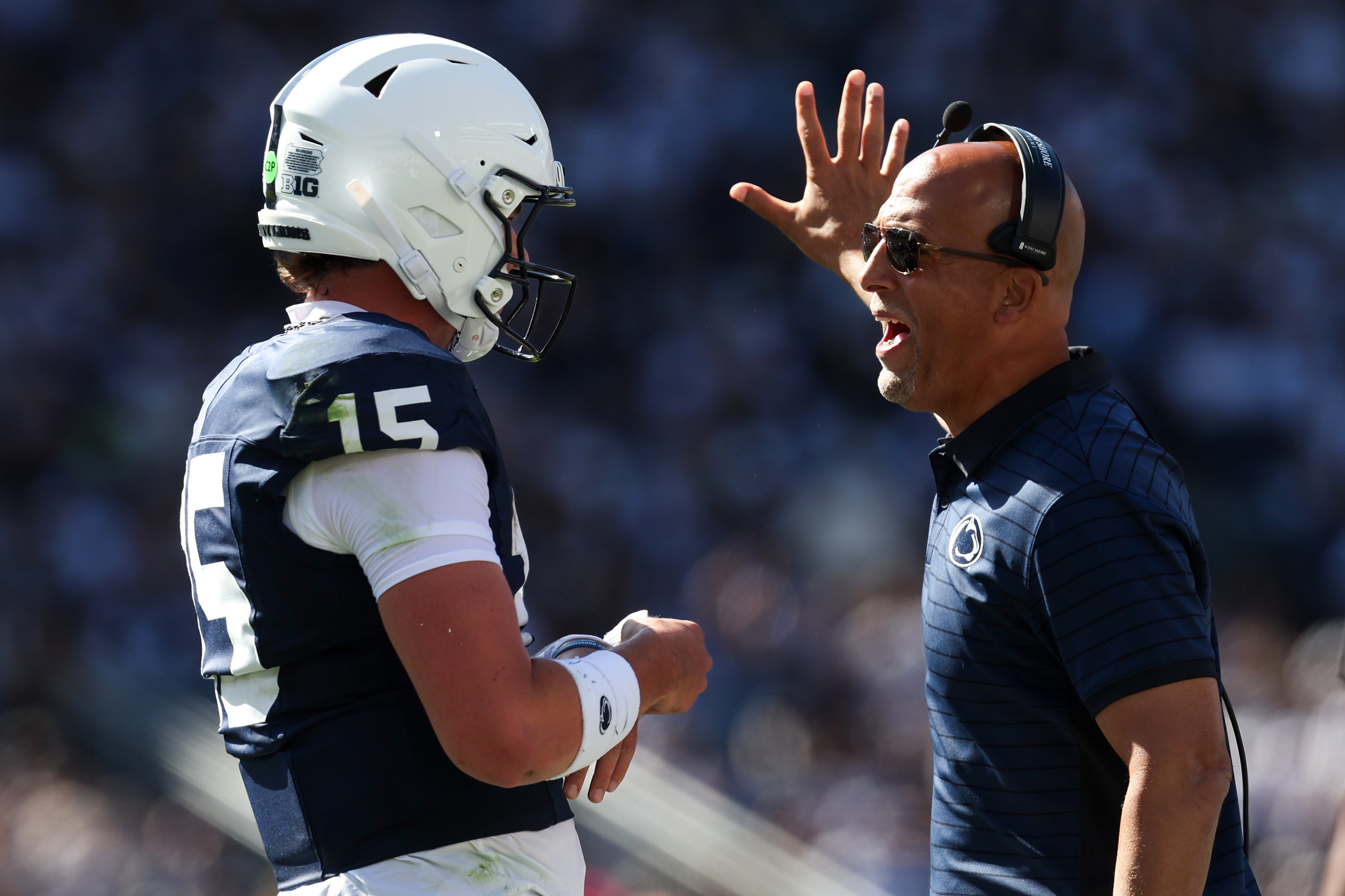 Aug 30, 2025; University Park, Pennsylvania, USA; Penn State Nittany Lions head coach James Franklin talks with quarterback Drew Allar (15) during the first quarter against the Nevada Wolf Pack at Beaver Stadium. Mandatory Credit: Matthew O'Haren-Imagn Images
