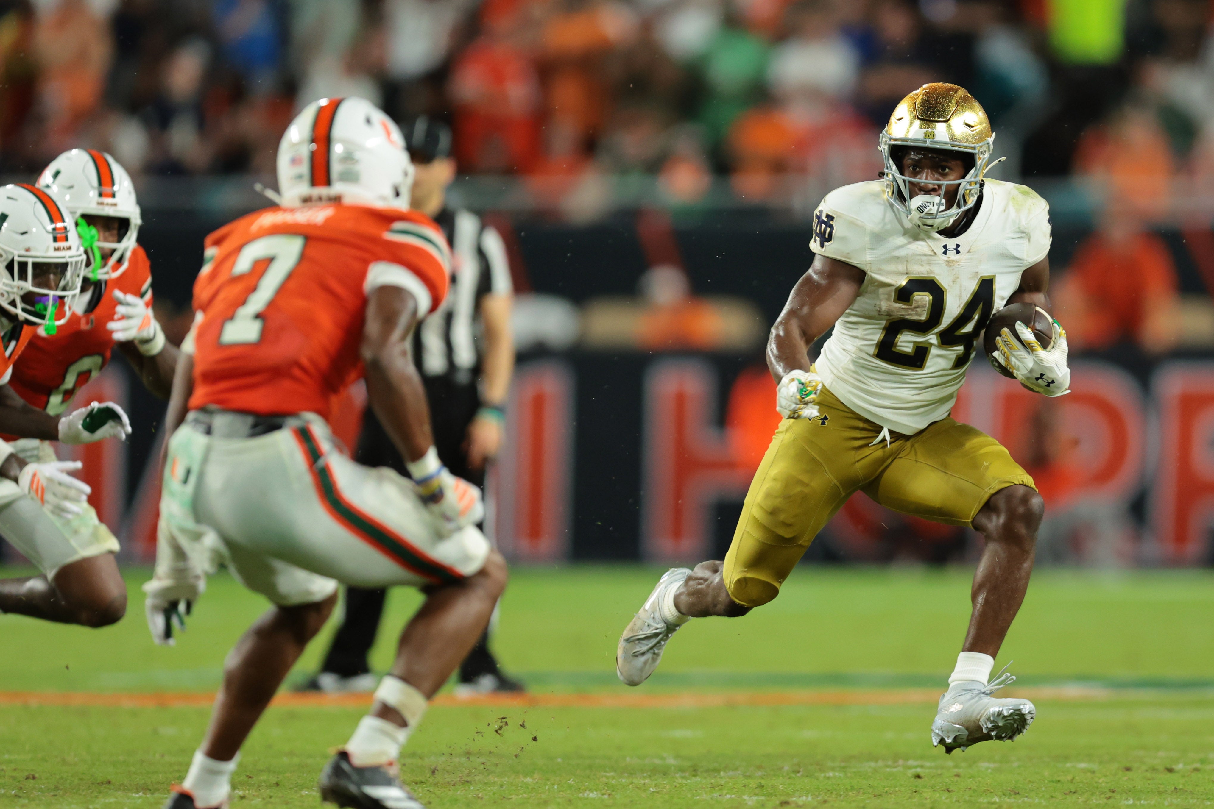 Aug 31, 2025; Miami Gardens, Florida, USA; Notre Dame Fighting Irish running back Jadarian Price (24) rushes the ball against the Miami Hurricanes during the second quarter at Hard Rock Stadium. Mandatory Credit: Sam Navarro-Imagn Images