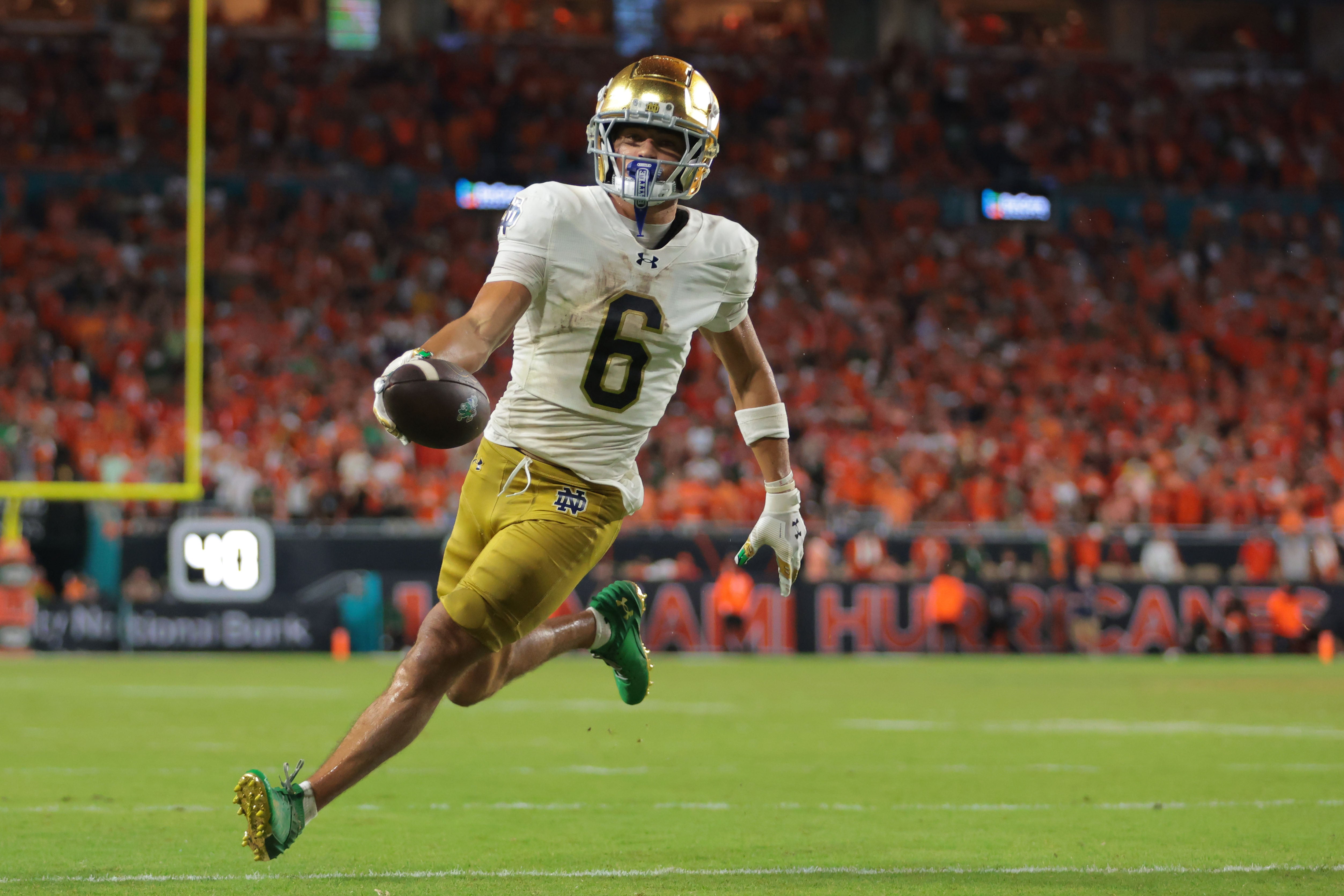 Aug 31, 2025; Miami Gardens, Florida, USA; Notre Dame Fighting Irish wide receiver Jordan Faison (6) scores a touchdown against the Miami Hurricanes during the third quarter at Hard Rock Stadium. Mandatory Credit: Sam Navarro-Imagn Images