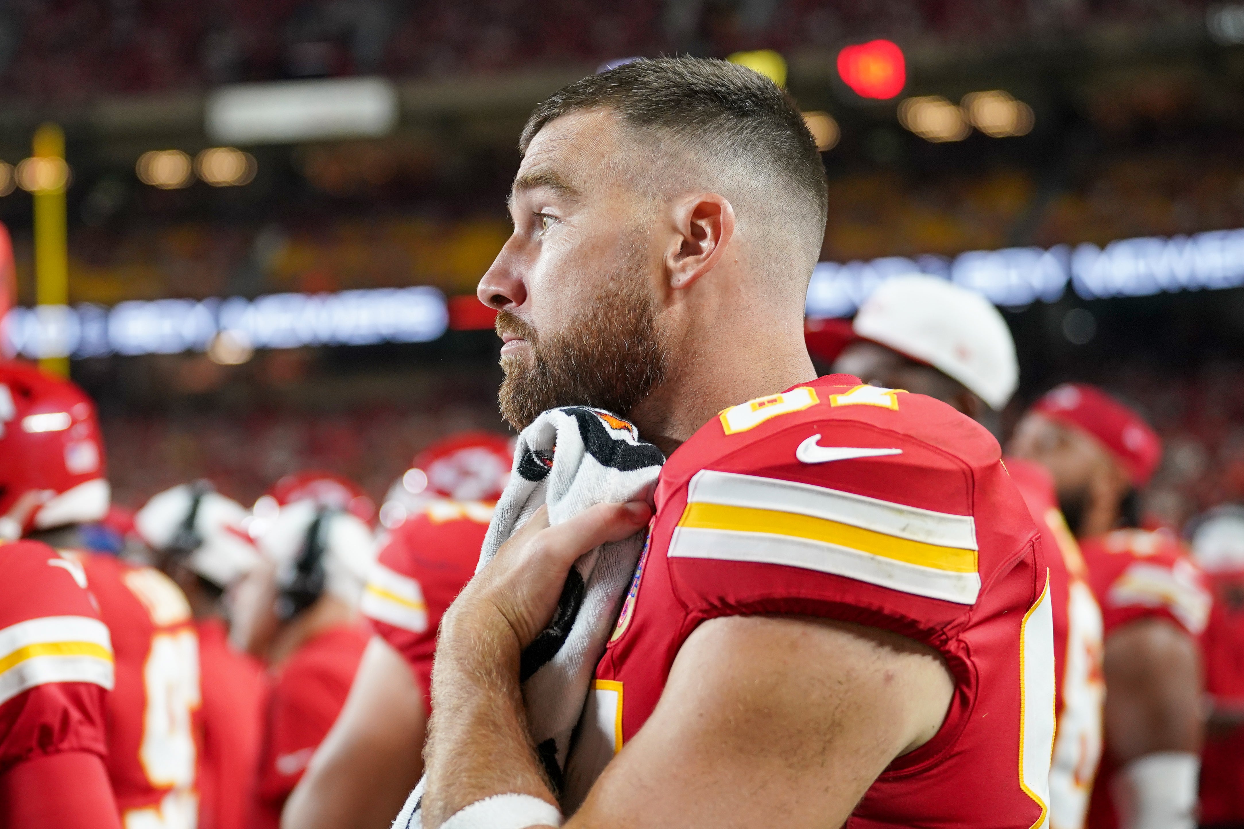 Aug 22, 2025; Kansas City, Missouri, USA; Kansas City Chiefs tight end Travis Kelce (87) on the sidelines against the Chicago Bears during the game at GEHA Field at Arrowhead Stadium.