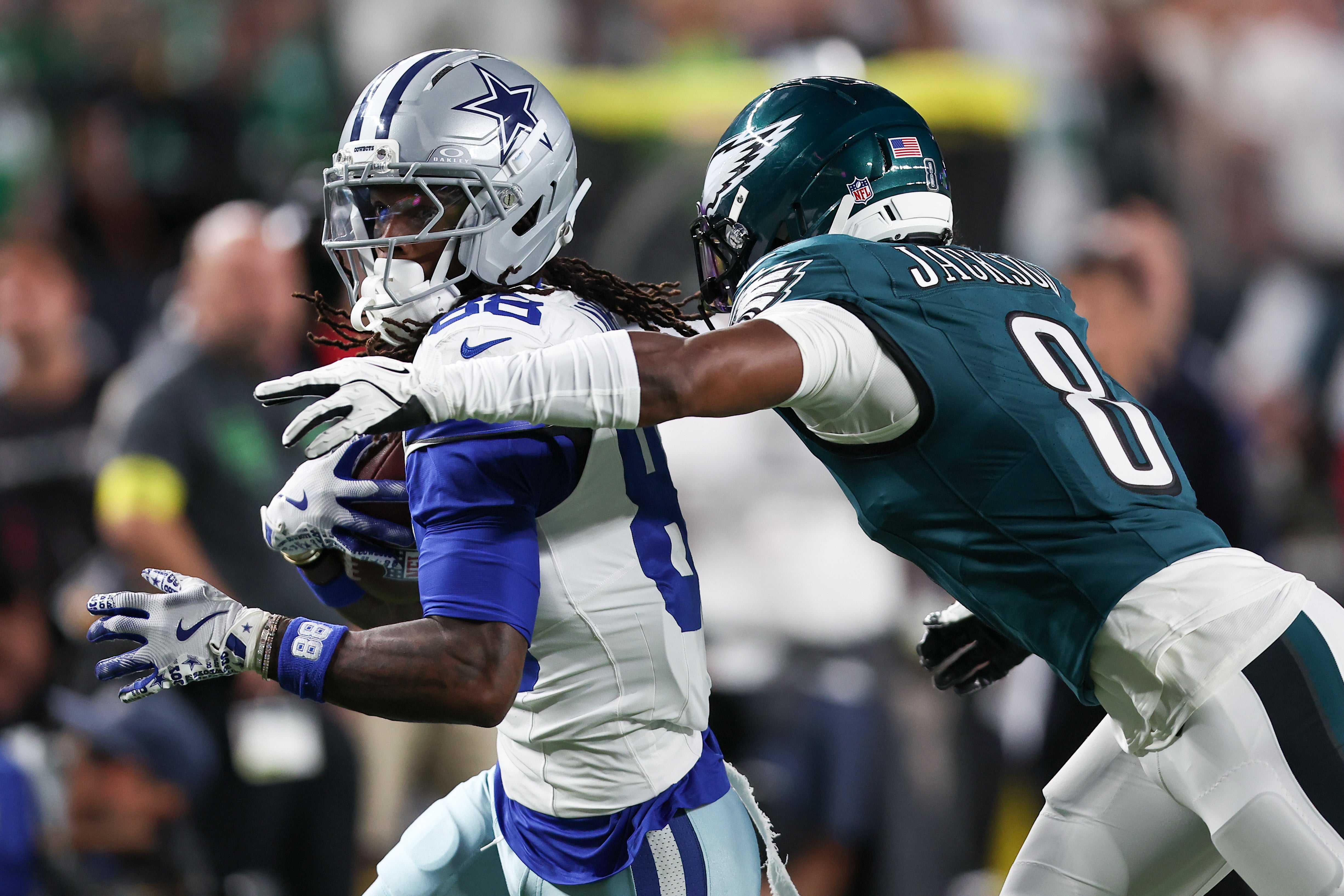 Philadelphia Eagles cornerback Adoree' Jackson (8) tackles Dallas Cowboys wide receiver CeeDee Lamb (88) during the first quarter of the game at Lincoln Financial Field.