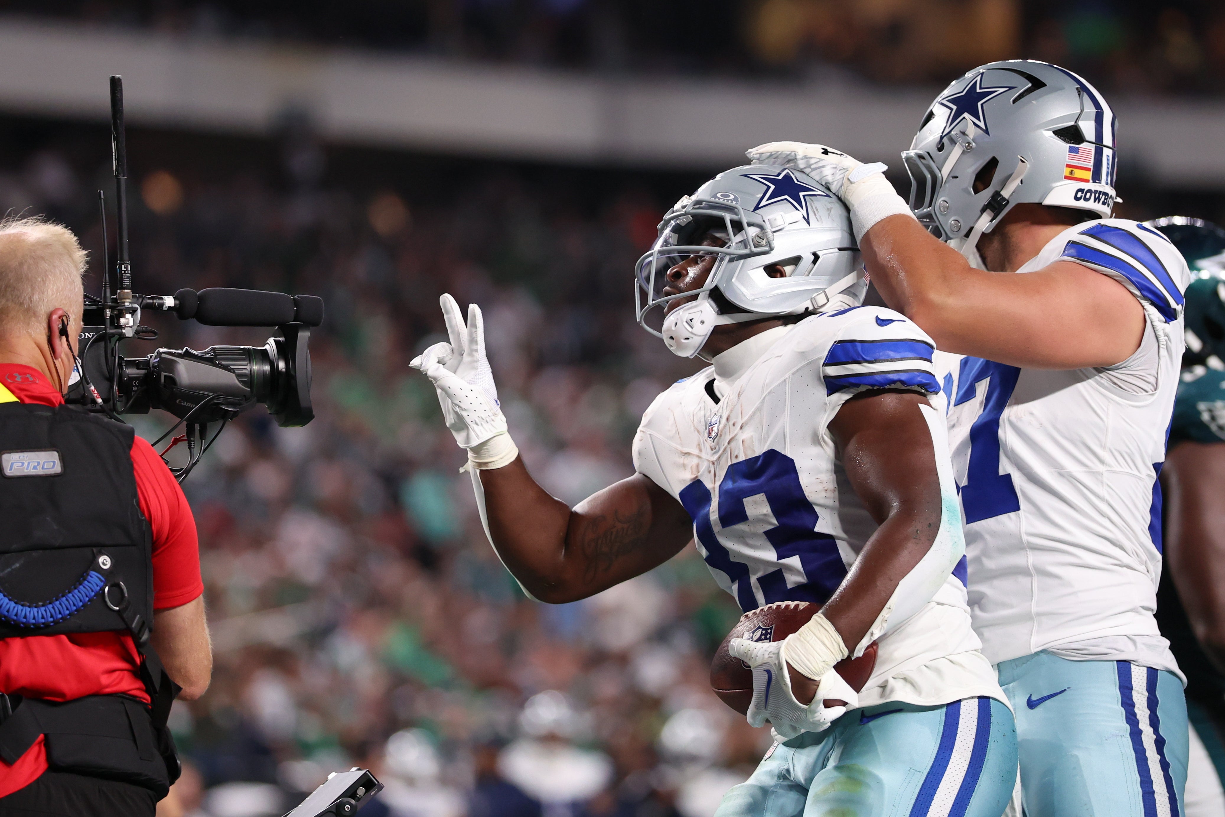 Sep 4, 2025; Philadelphia, Pennsylvania, USA; Dallas Cowboys running back Javonte Williams (33) celebrates with his teammates after scoring a touchdown against the Philadelphia Eagles during the first quarter of the game at Lincoln Financial Field.
