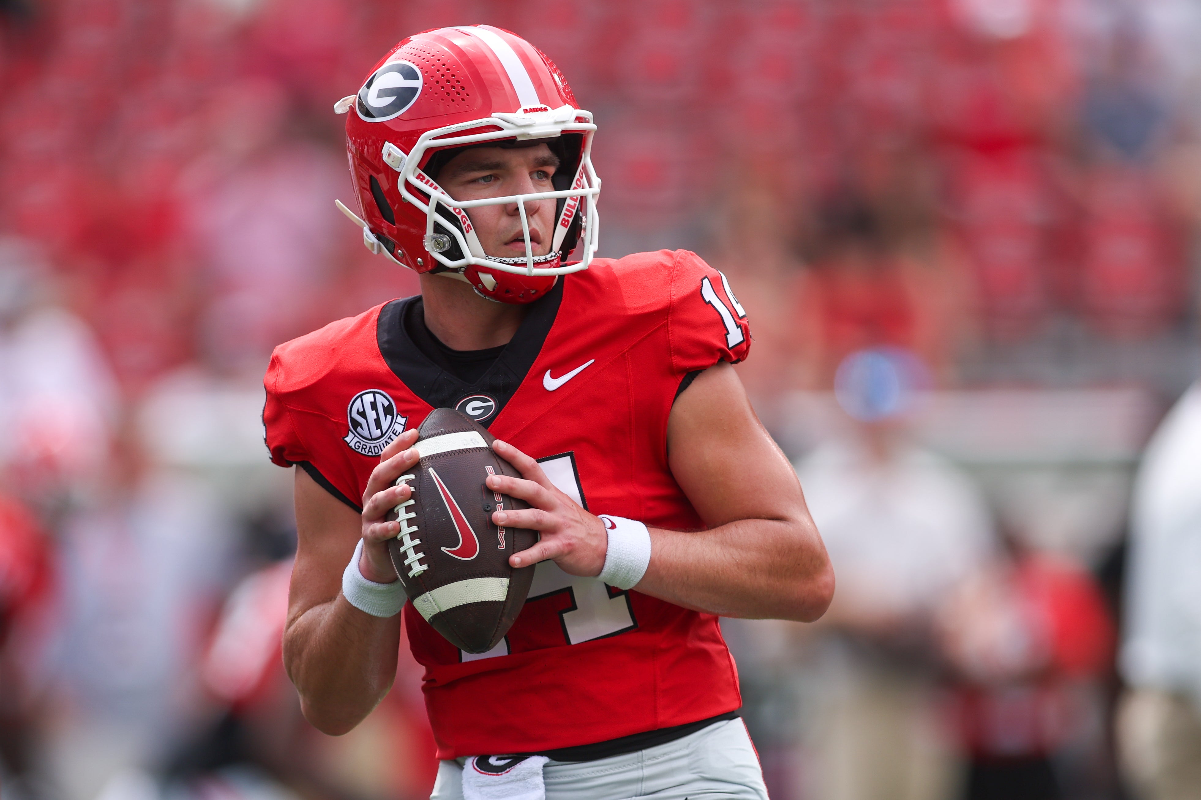 Georgia Bulldogs quarterback Gunner Stockton (14) prepares for a game against the Austin Peay Governors at Sanford Stadium.