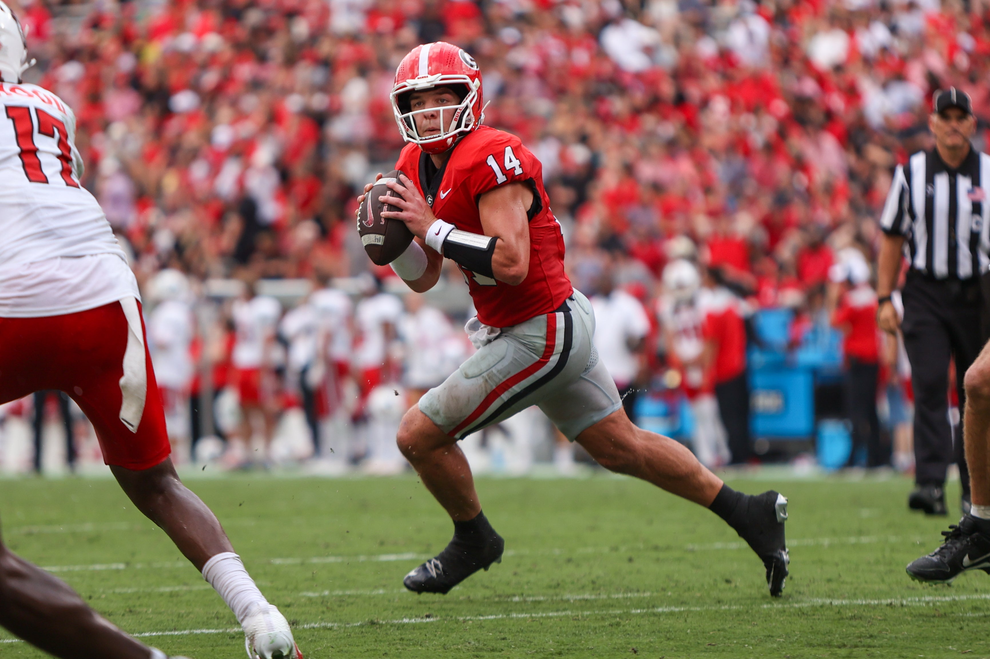Georgia Bulldogs quarterback Gunner Stockton (14) looks to throw against the Austin Peay Governors in the second quarter at Sanford Stadium.