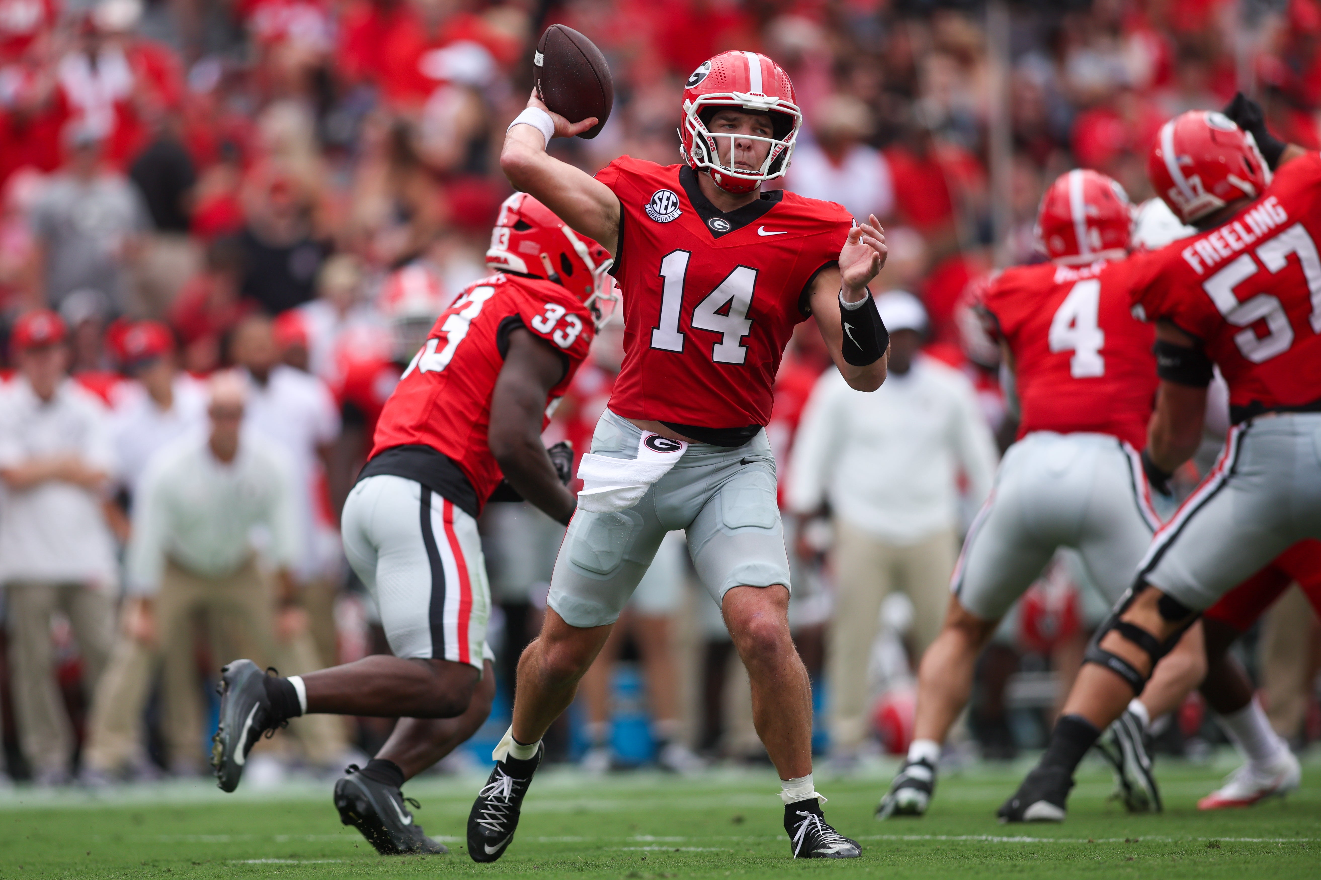 Georgia Bulldogs quarterback Gunner Stockton (14) throws a pass against the Austin Peay Governors in the first quarter at Sanford Stadium.