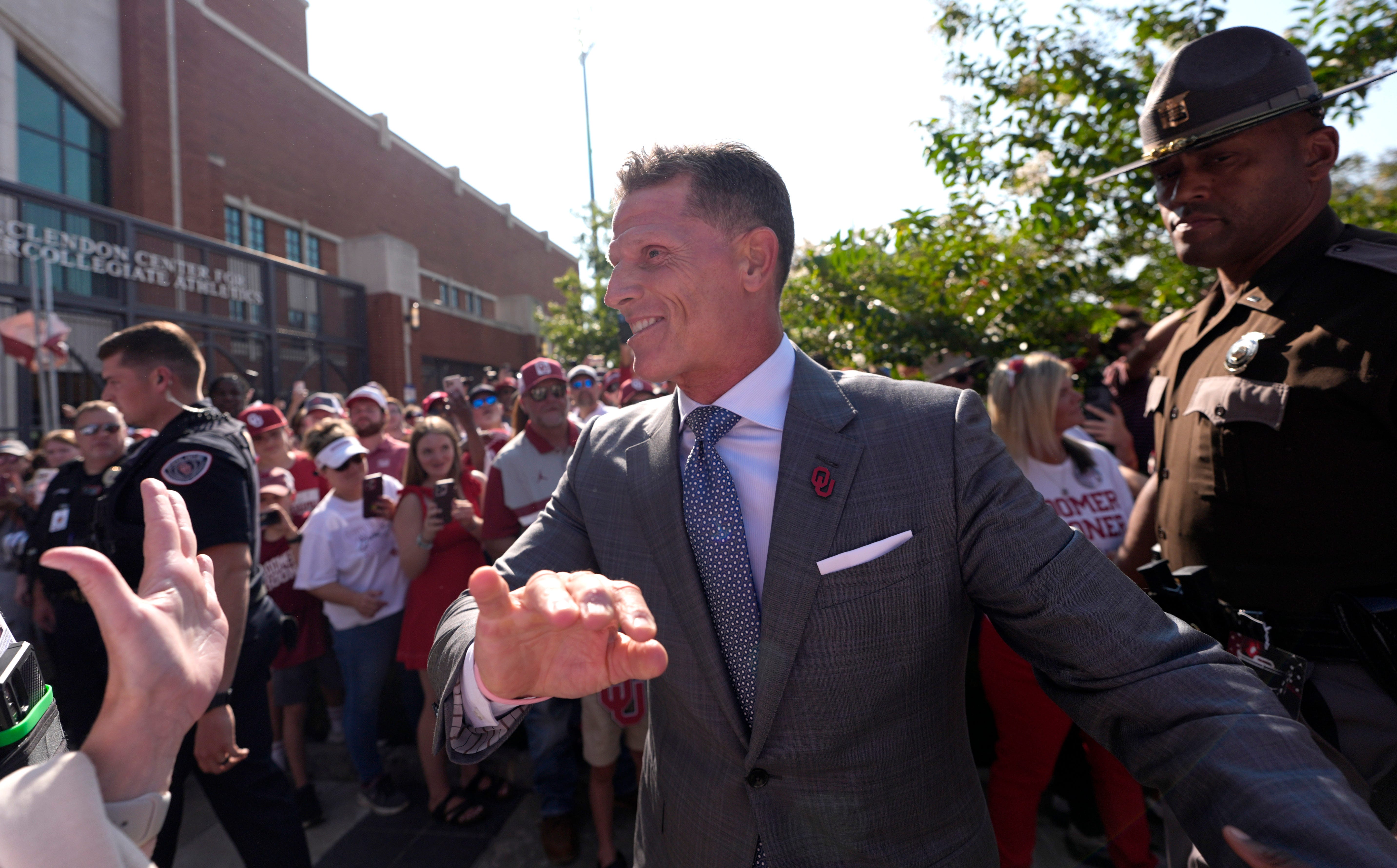 Oklahoma head coach Brent Venables greets fans as the arrive before the college football game between the University of Oklahoma Sooner and the University of Michigan Wolverines at the Gaylord Family Ð Oklahoma Memorial Stadium in Norman, Okla., Saturday, Sept. 6, 2025.