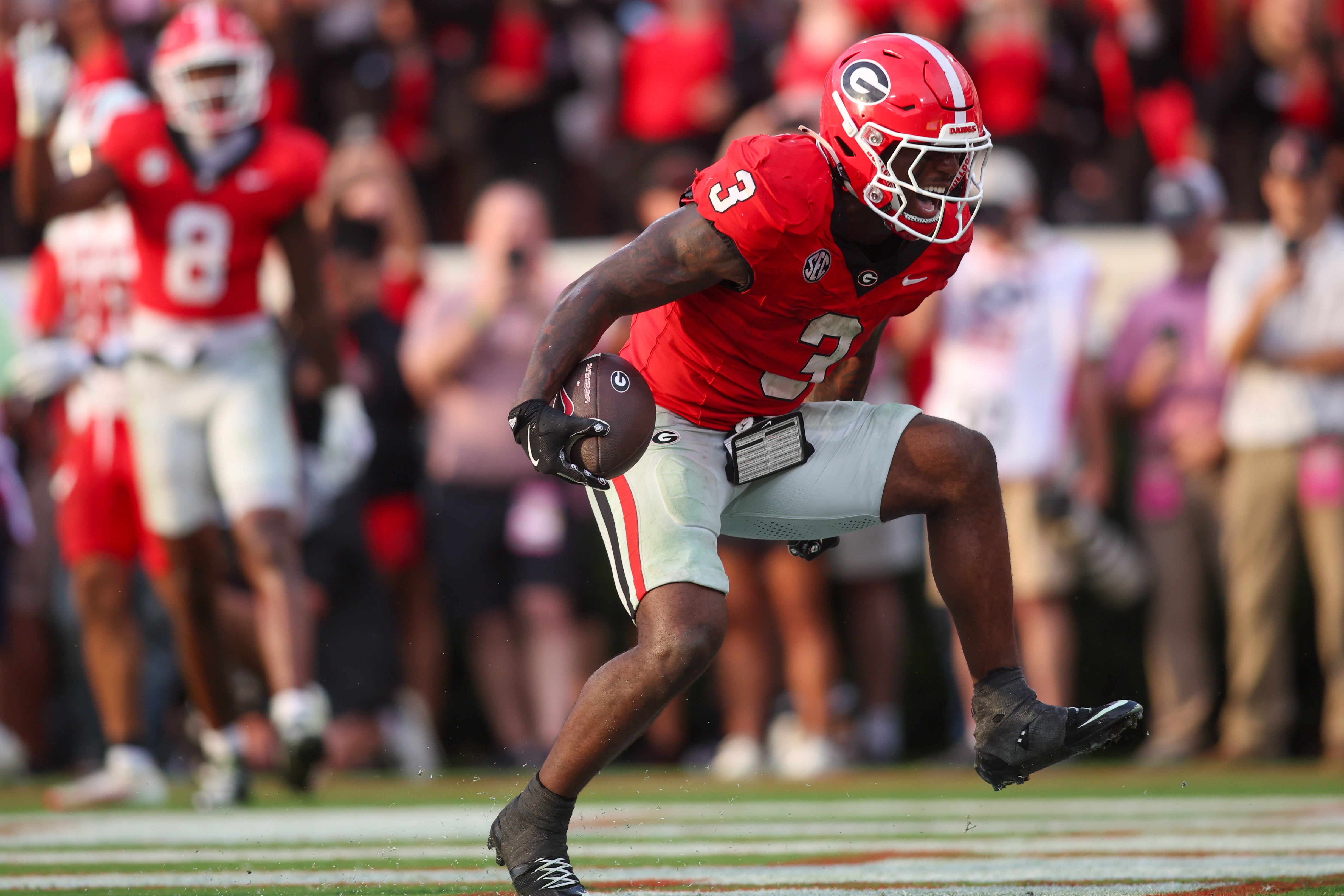 Georgia Bulldogs running back Nate Frazier (3) celebrates after a touchdown against the Austin Peay Governors in the fourth quarter at Sanford Stadium.