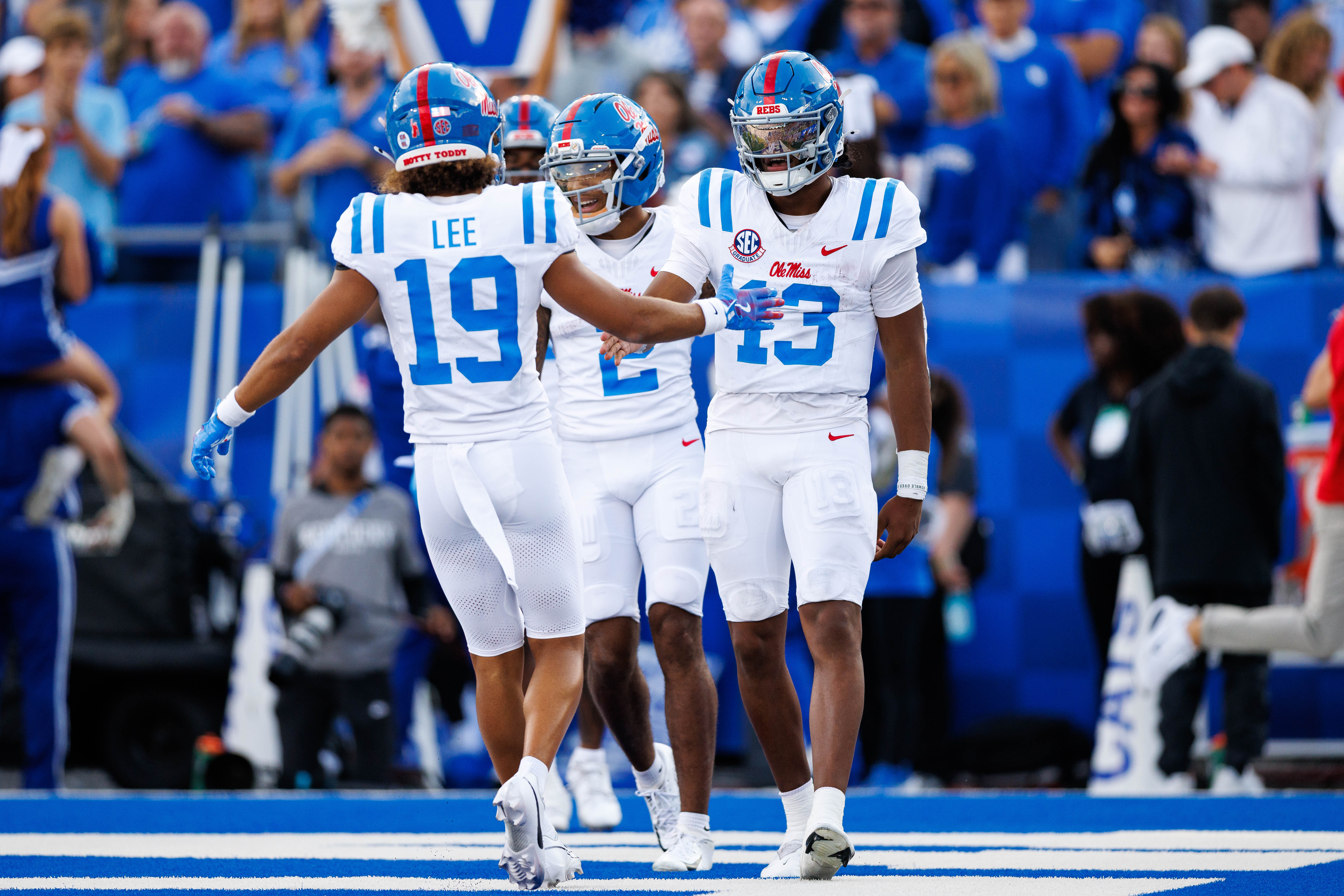 Sep 6, 2025; Lexington, Kentucky, USA; Mississippi Rebels quarterback Austin Simmons (13) celebrates with wide receiver Cayden Lee (19) after scoring a touchdown during the third quarter against the Kentucky Wildcats at Kroger Field.