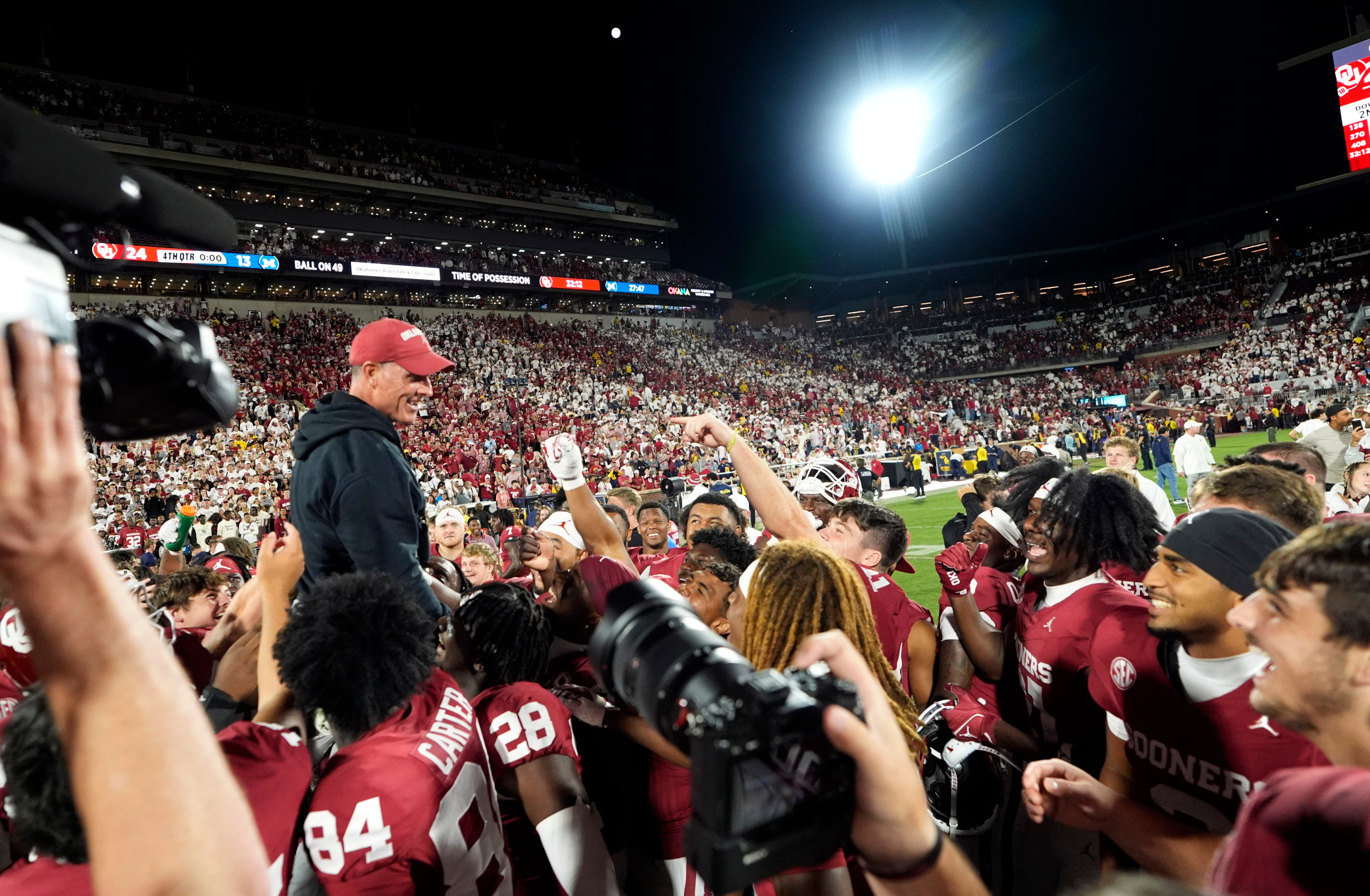 Oklahoma players lift head coach Brent Venables on their shoulders following the college football game between the University of Oklahoma Sooner and the University of Michigan Wolverines at the Gaylord Family Ð Oklahoma Memorial Stadium in Norman, Okla., Saturday, Sept. 6, 2025.