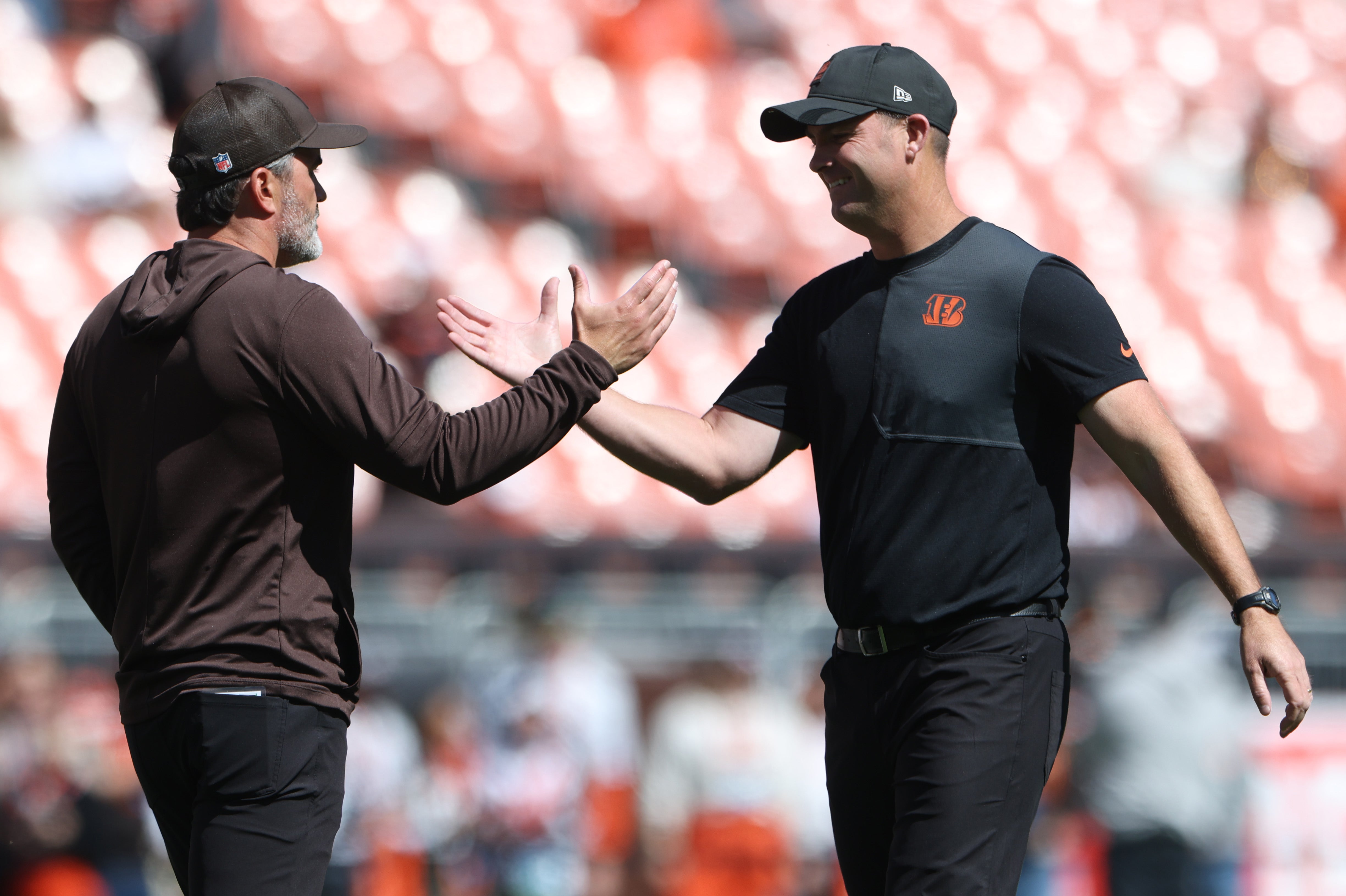 Sep 7, 2025; Cleveland, Ohio, USA; Cleveland Browns head coach Kevin Stefanski (left) and Cincinnati Bengals head coach Zac Taylor before a game at Huntington Bank Field.