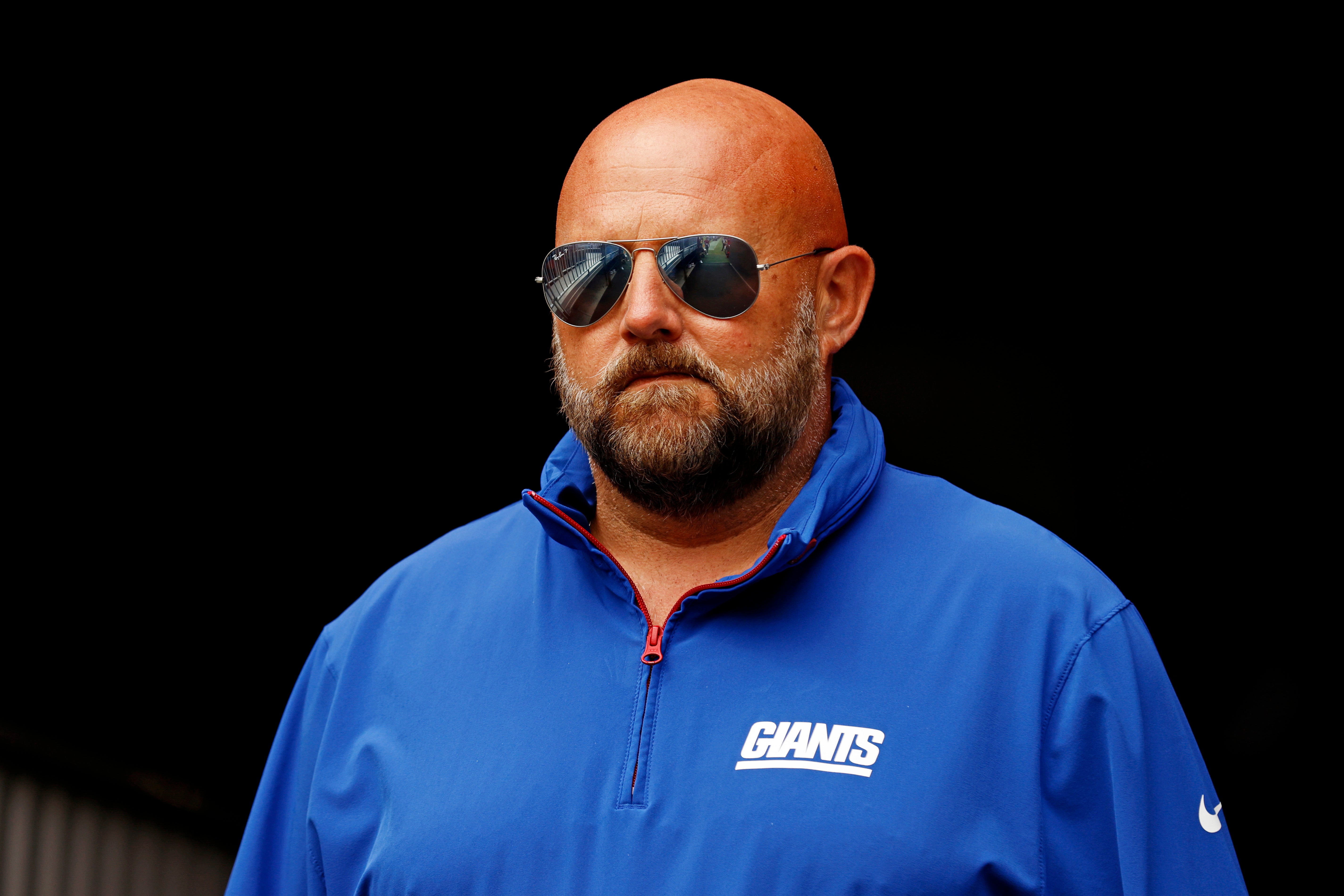 Sep 7, 2025; Landover, Maryland, USA; The New York Giants head coach Brian Daboll enters the field before the game against the Washington Commanders at Northwest Stadium.