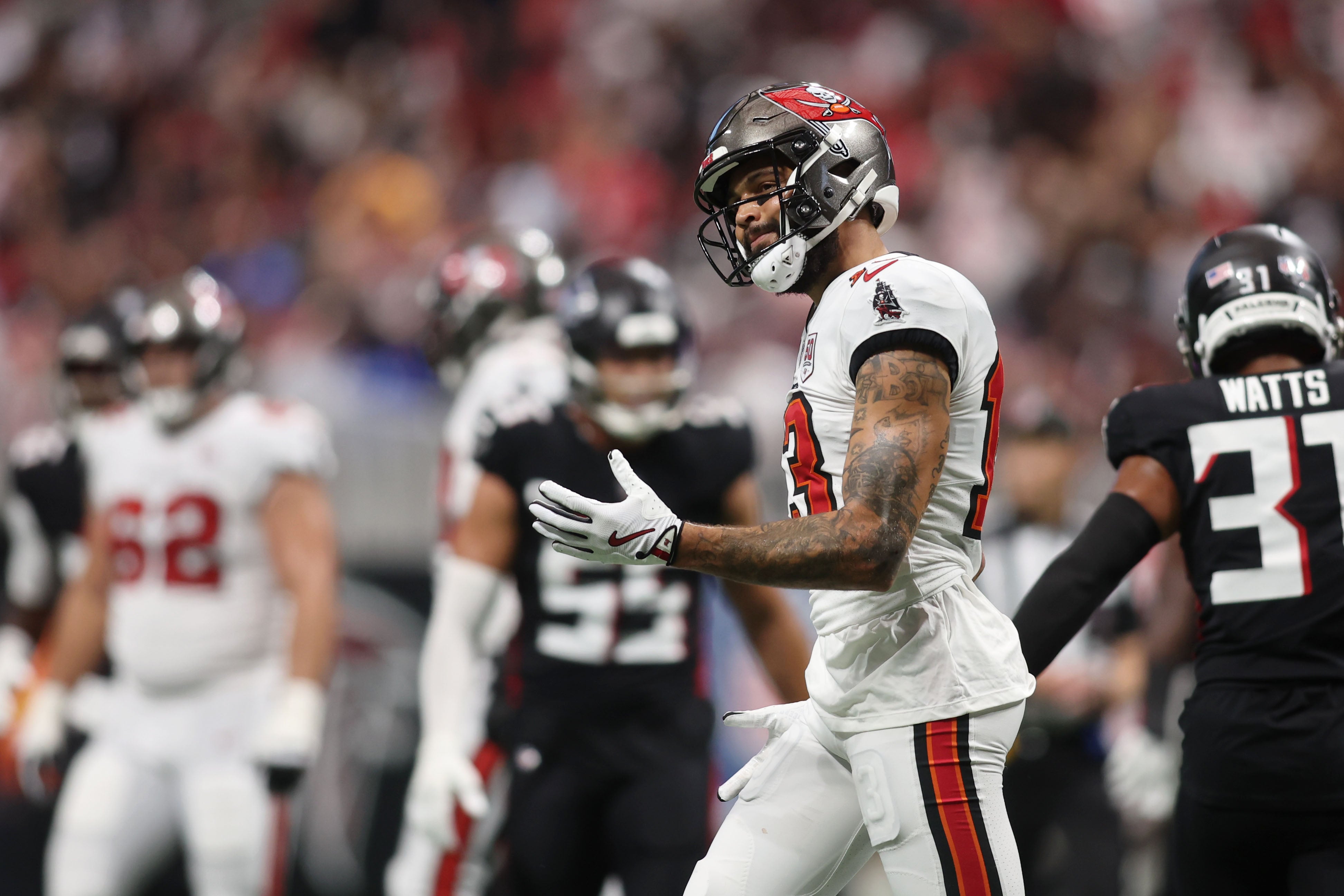 Sep 7, 2025; Atlanta, Georgia, USA; Tampa Bay Buccaneers wide receiver Mike Evans (13) reacts after a play against the Atlanta Falcons during the second quarter at Mercedes-Benz Stadium.