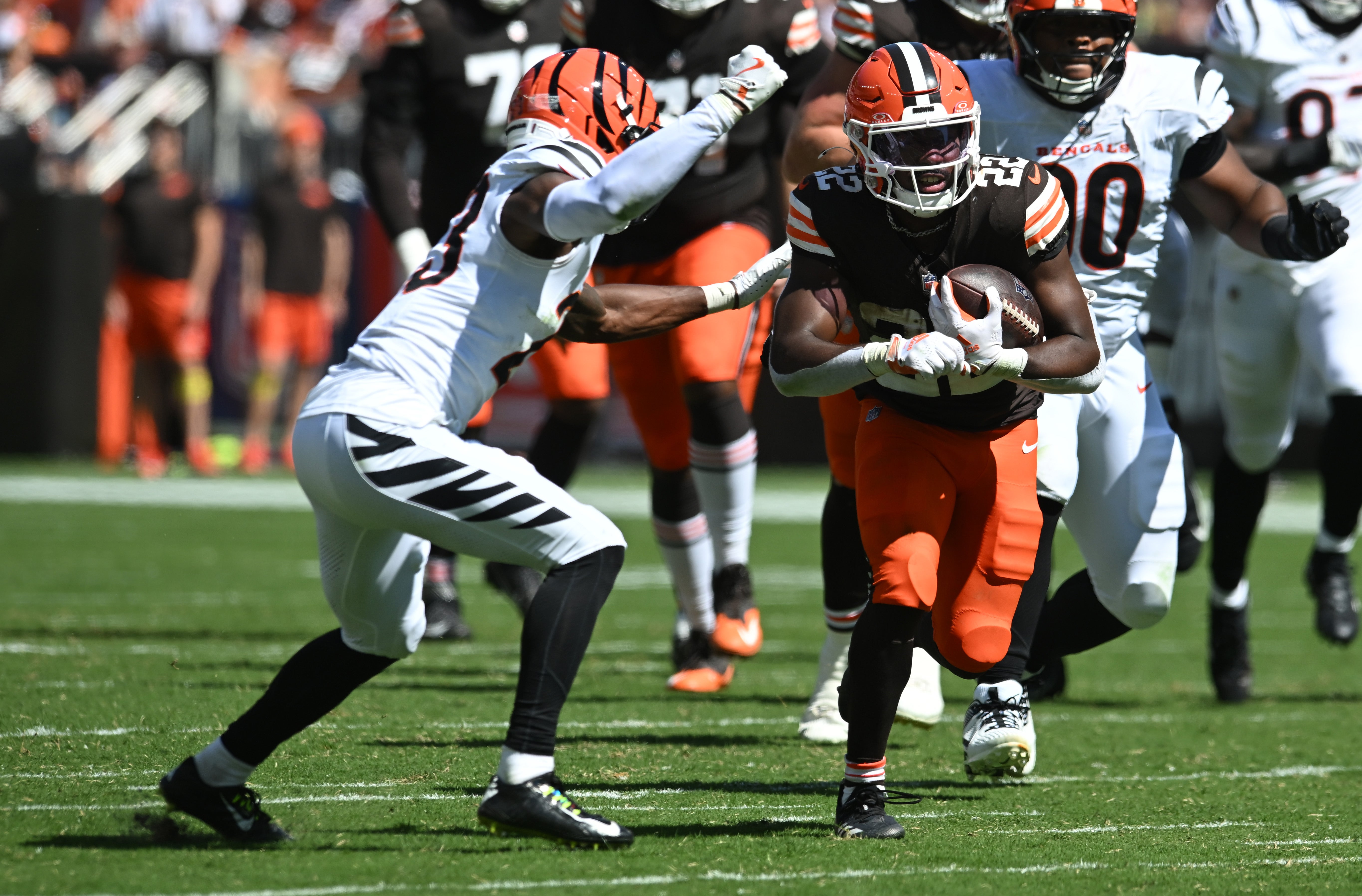 Sep 7, 2025; Cleveland, Ohio, USA; Cleveland Browns running back Dylan Sampson (22) runs against Cincinnati Bengals cornerback Dax Hill (23) during the second half at Huntington Bank Field.