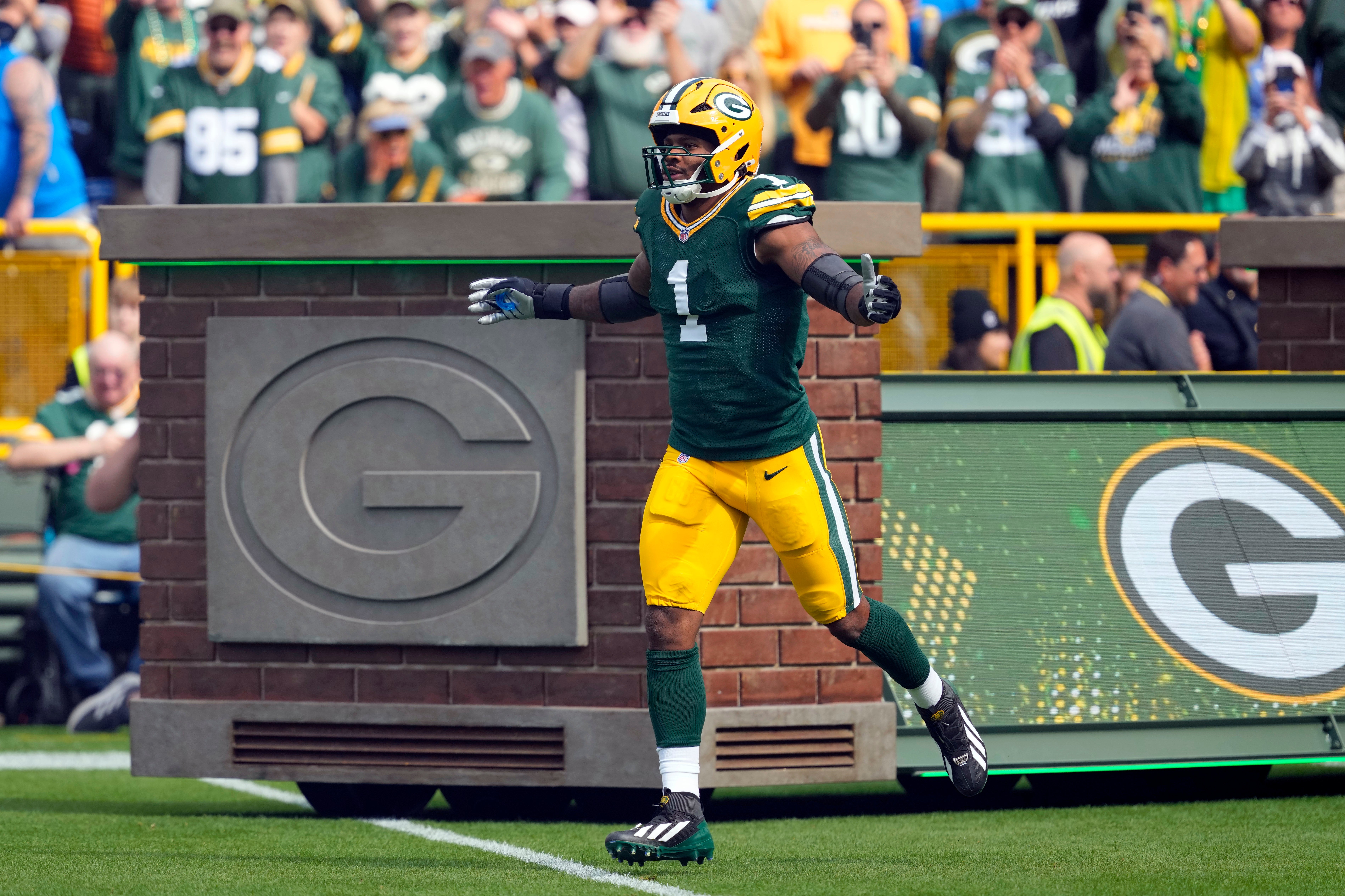Sep 7, 2025; Green Bay, Wisconsin, USA; Green Bay Packers defensive end Micah Parsons (1) runs onto the field before the game against the Detroit Lions at Lambeau Field.
