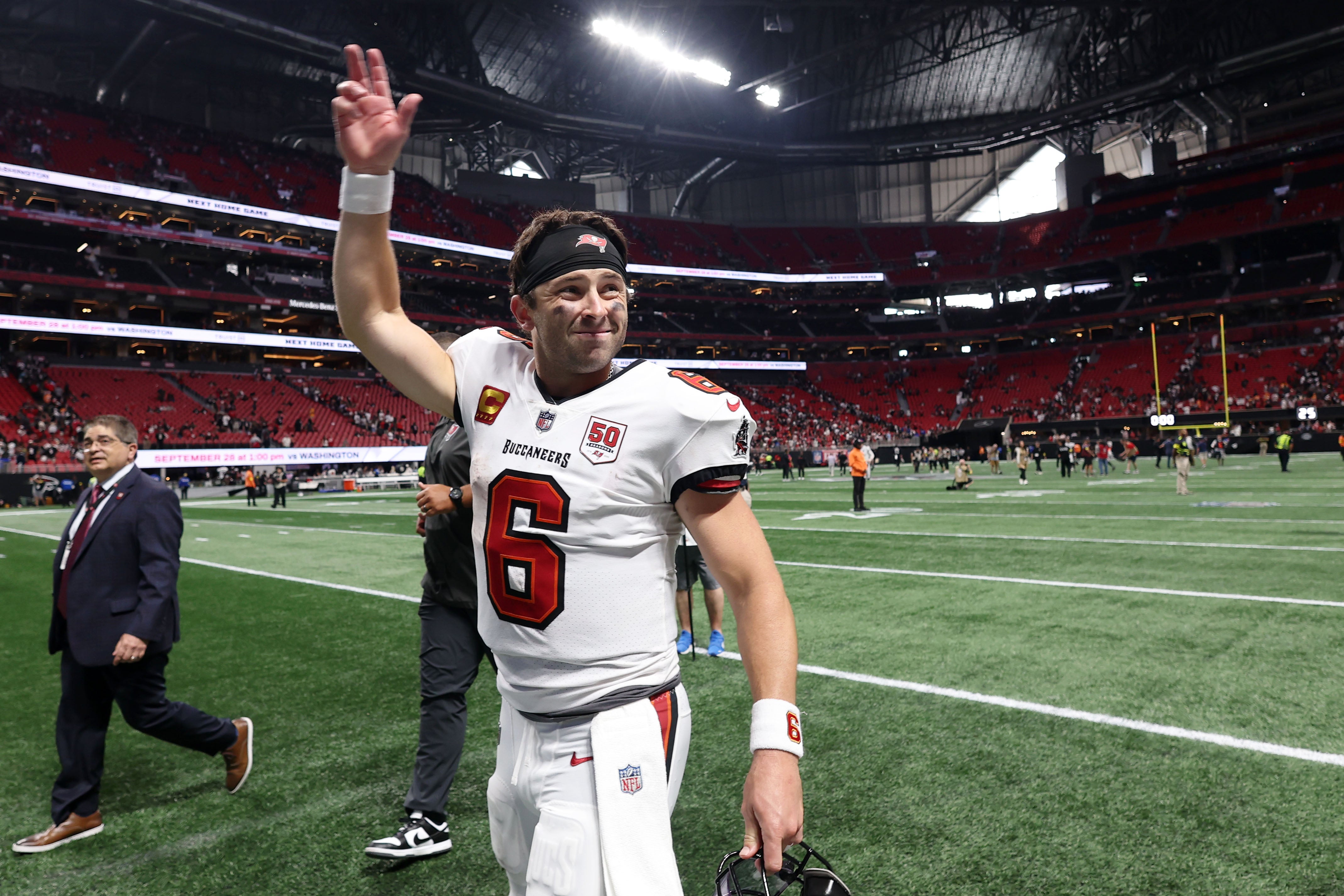 Sep 7, 2025; Atlanta, Georgia, USA; Tampa Bay Buccaneers quarterback Baker Mayfield (6) waves to fans after their win against the Atlanta Falcons at Mercedes-Benz Stadium.