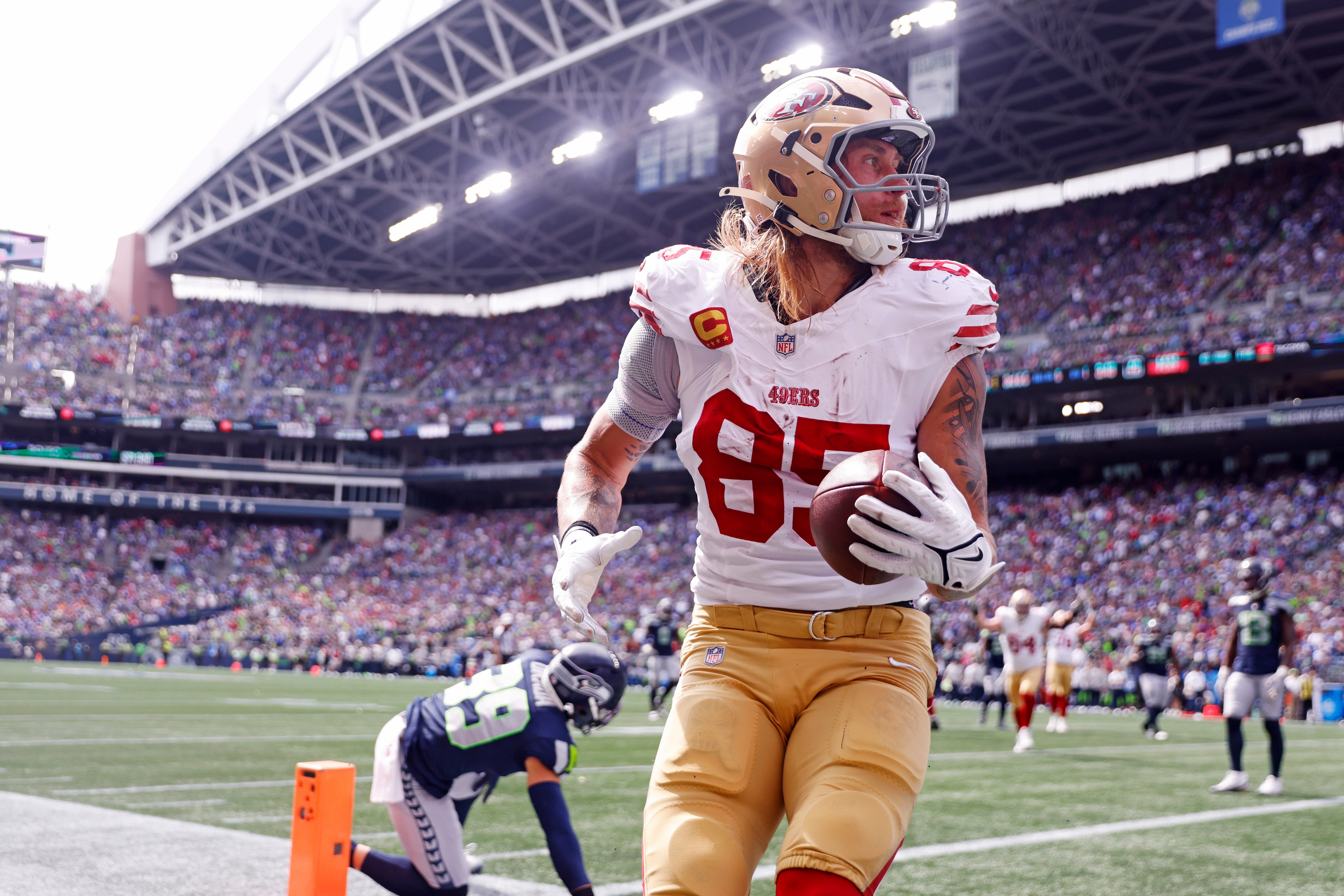 Sep 7, 2025; Seattle, Washington, USA; San Francisco 49ers tight end George Kittle (85) celebrates after scoring a touchdown during the first half against the Seattle Seahawks during the first quarter at Lumen Field.