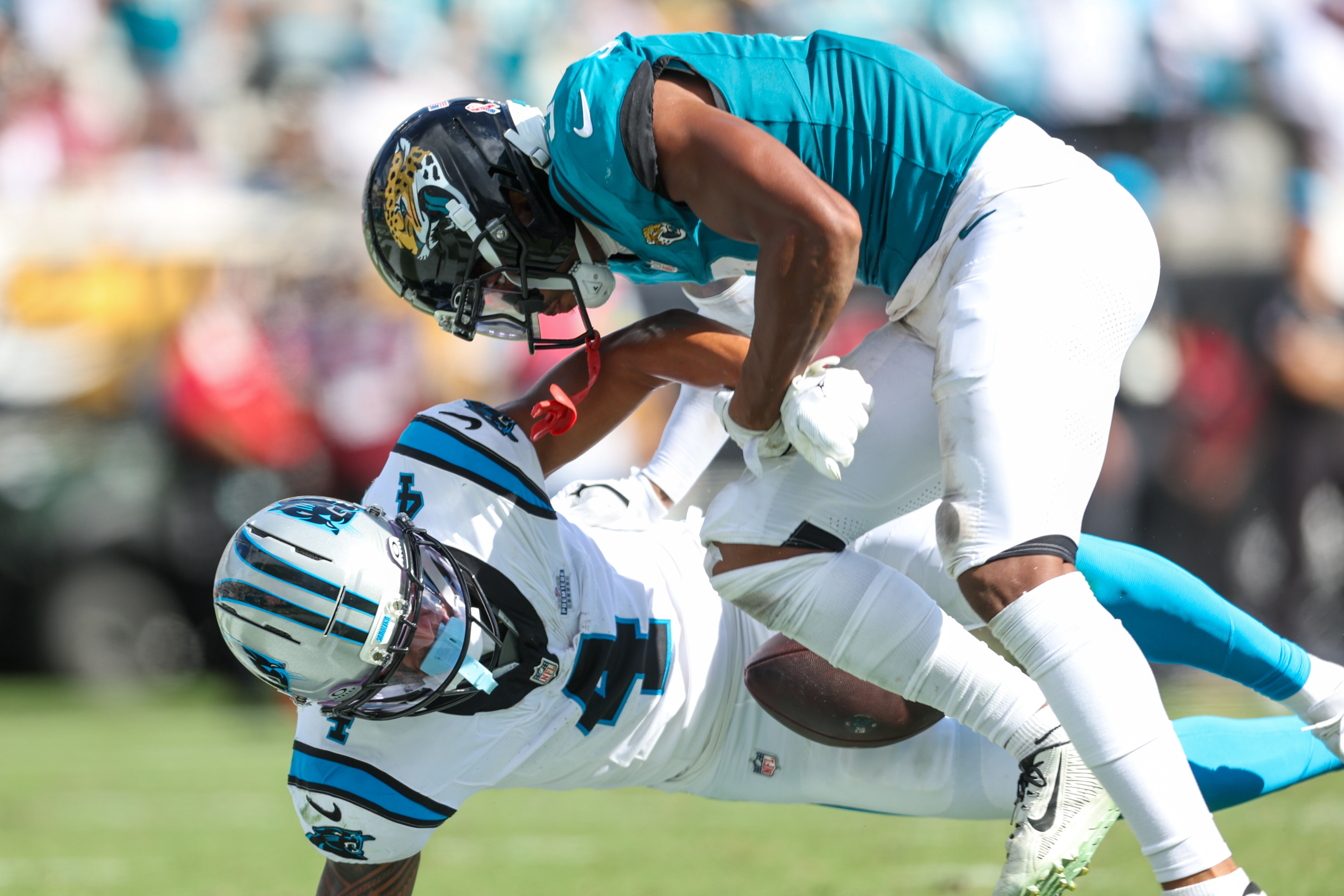 Sep 7, 2025; Jacksonville, Florida, USA; Jacksonville Jaguars cornerback Tyson Campbell (3) defends Carolina Panthers wide receiver Tetairoa McMillan (4) during the second half at EverBank Stadium.