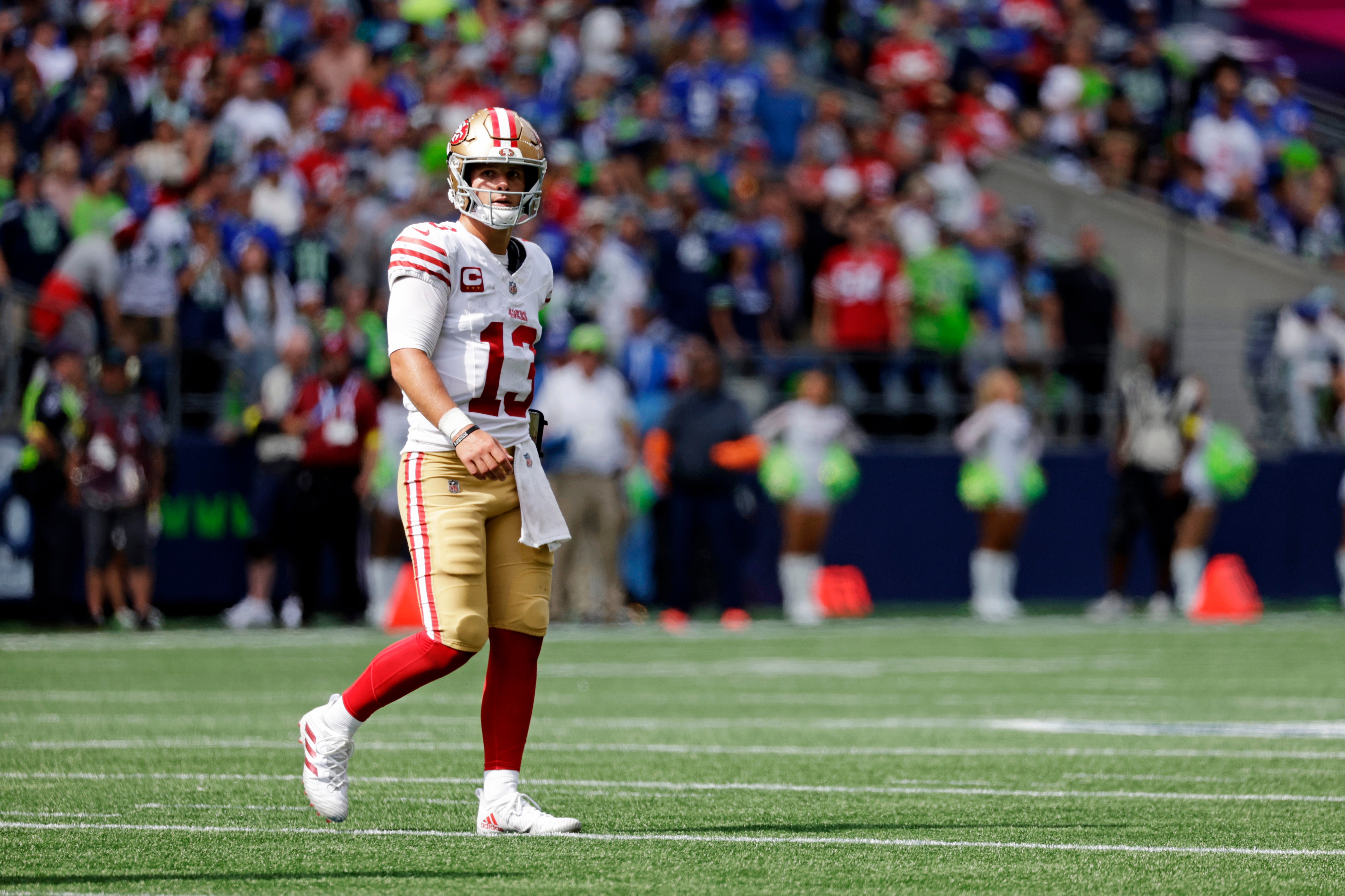 Sep 7, 2025; Seattle, Washington, USA; San Francisco 49ers quarterback Brock Purdy (13) looks on during the first half against the Seattle Seahawks at Lumen Field.