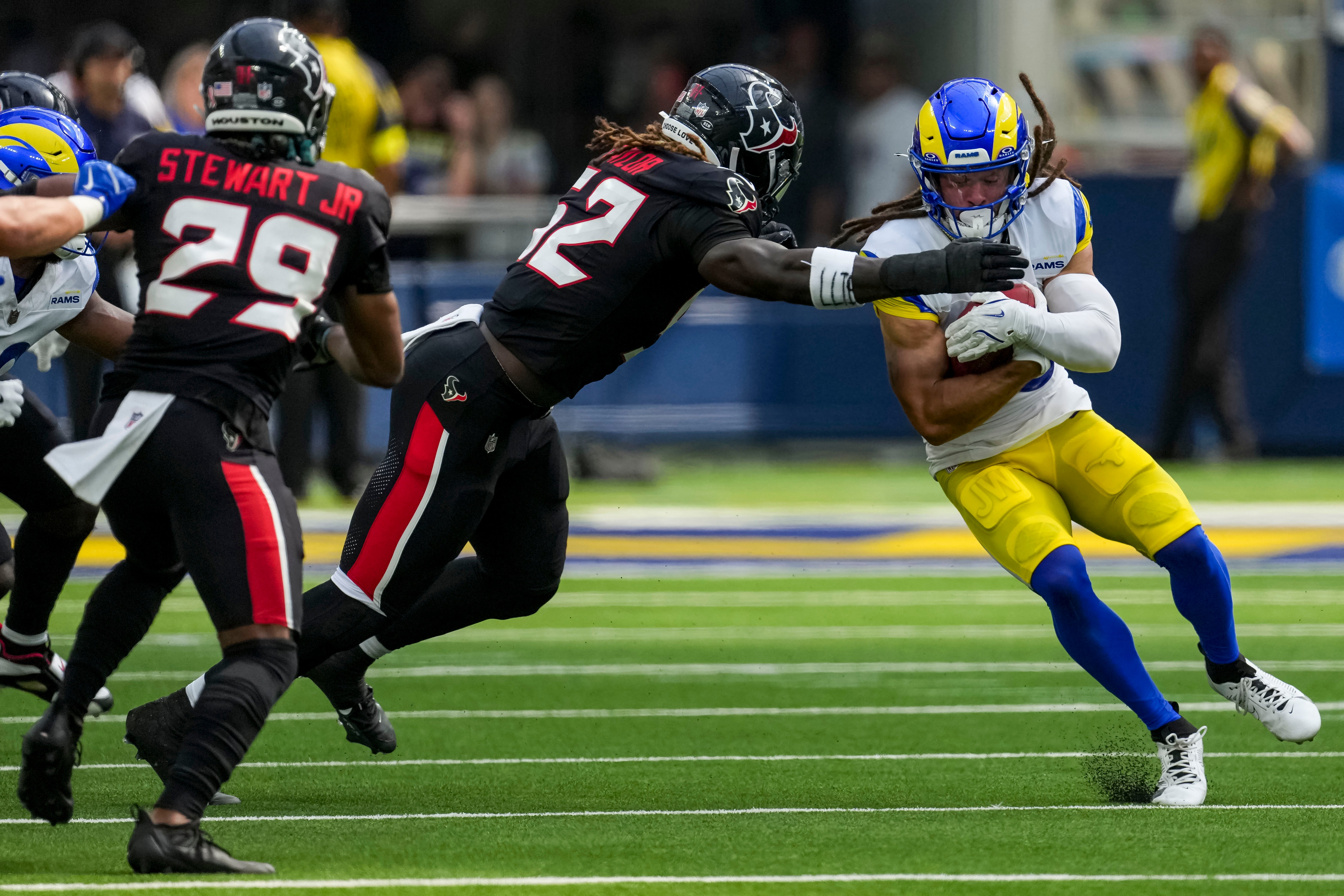 Sep 7, 2025; Inglewood, California, USA; Houston Texans defensive end Darrell Taylor (52) tackles Los Angeles Rams wide receiver Jordan Whittington (88) during the third quarter at SoFi Stadium.