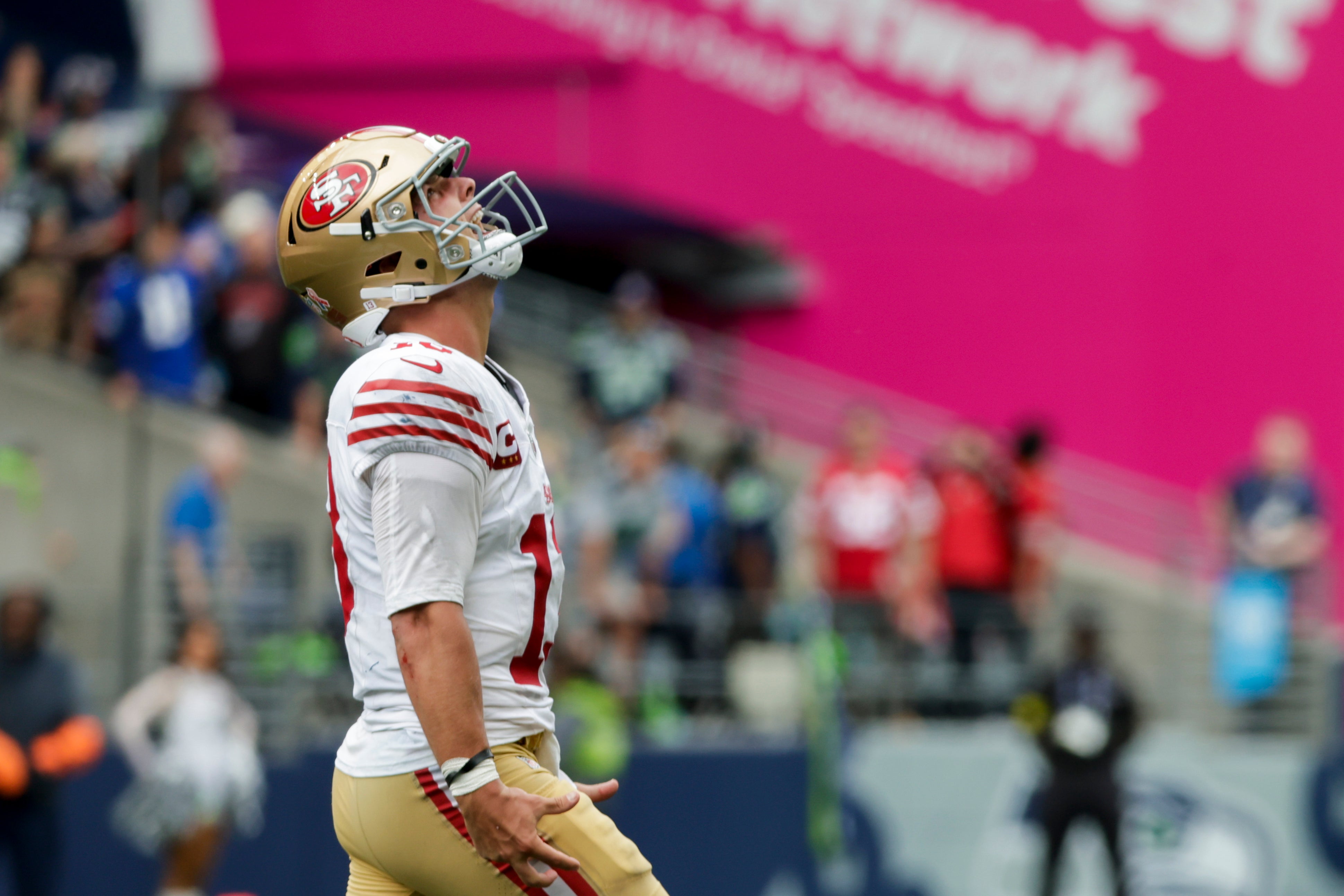 Sep 7, 2025; Seattle, Washington, USA; San Francisco 49ers quarterback Brock Purdy celebrates after throwing a touchdown pass against the Seattle Seahawks during the fourth quarter at Lumen Field.