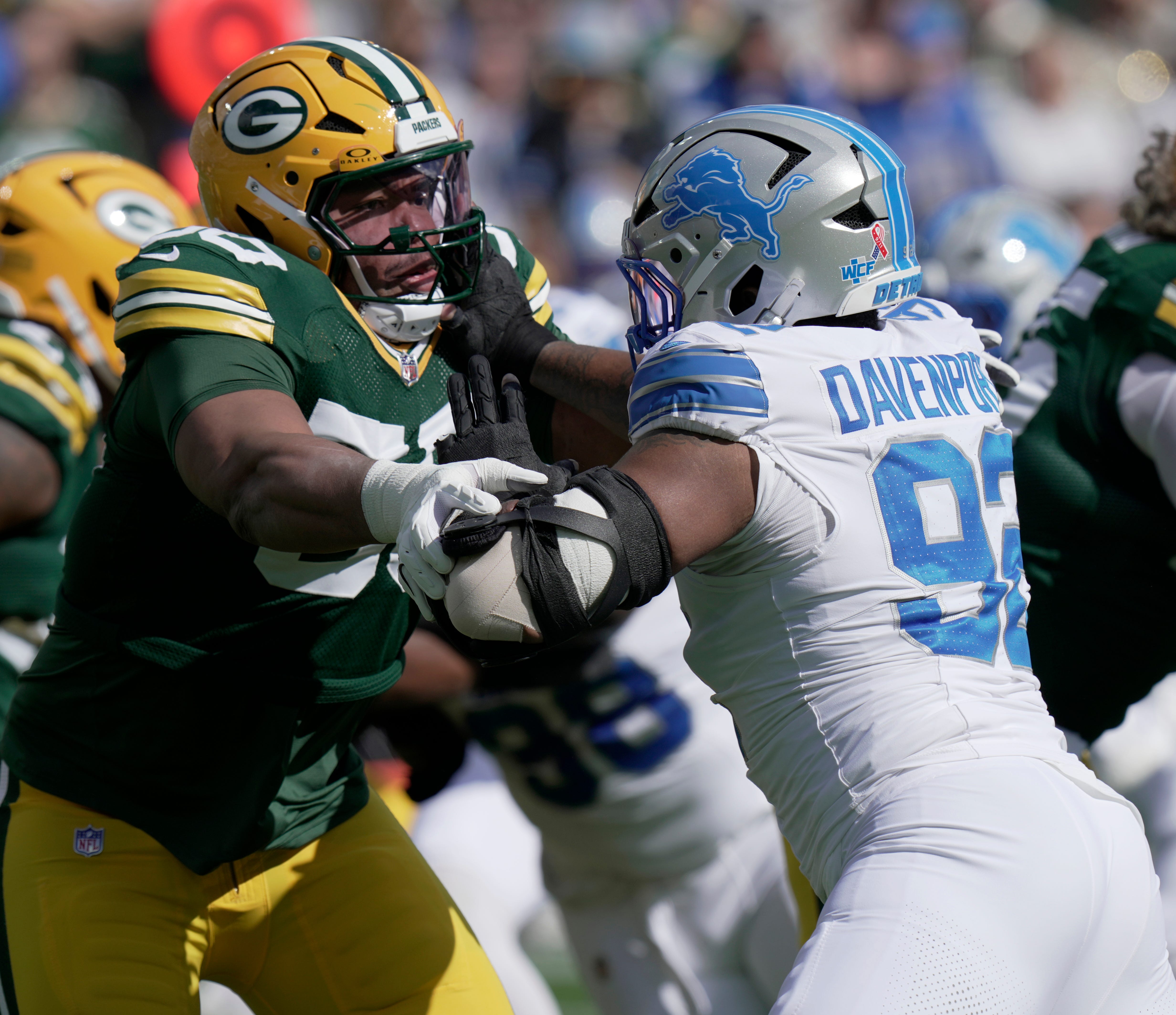 Green Bay Packers offensive tackle Zach Tom (50) blocks Detroit Lions defensive tackle Marcus Davenport (92) during the first quarter of their game Sunday, September 7, 2025 at Lambeau Field in Green Bay, Wisconsin.