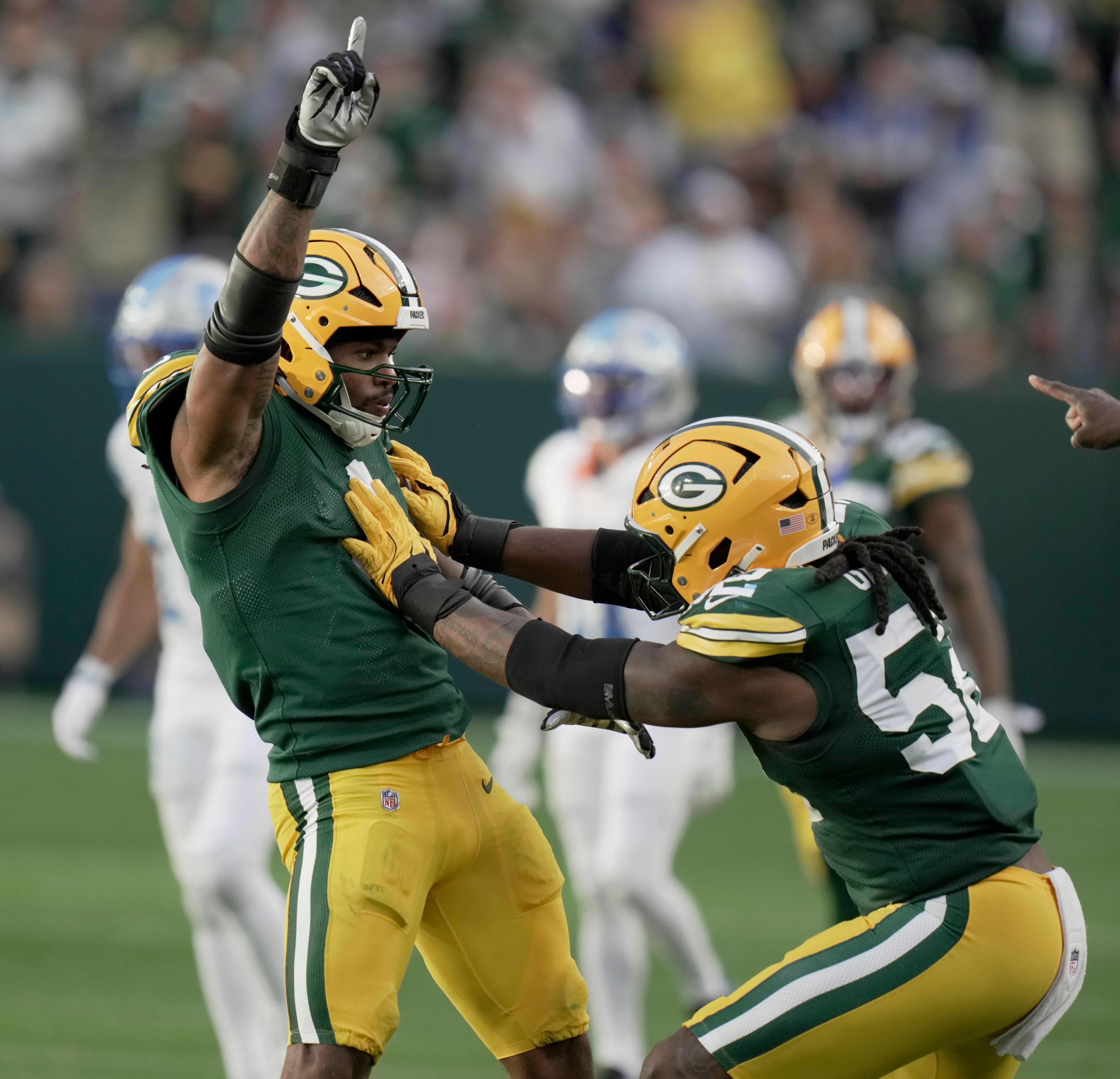 Green Bay Packers defensive end Micah Parsons (1) celebrates his sack against the Detroit Lions during the fourth quarter at Lambeau Field.