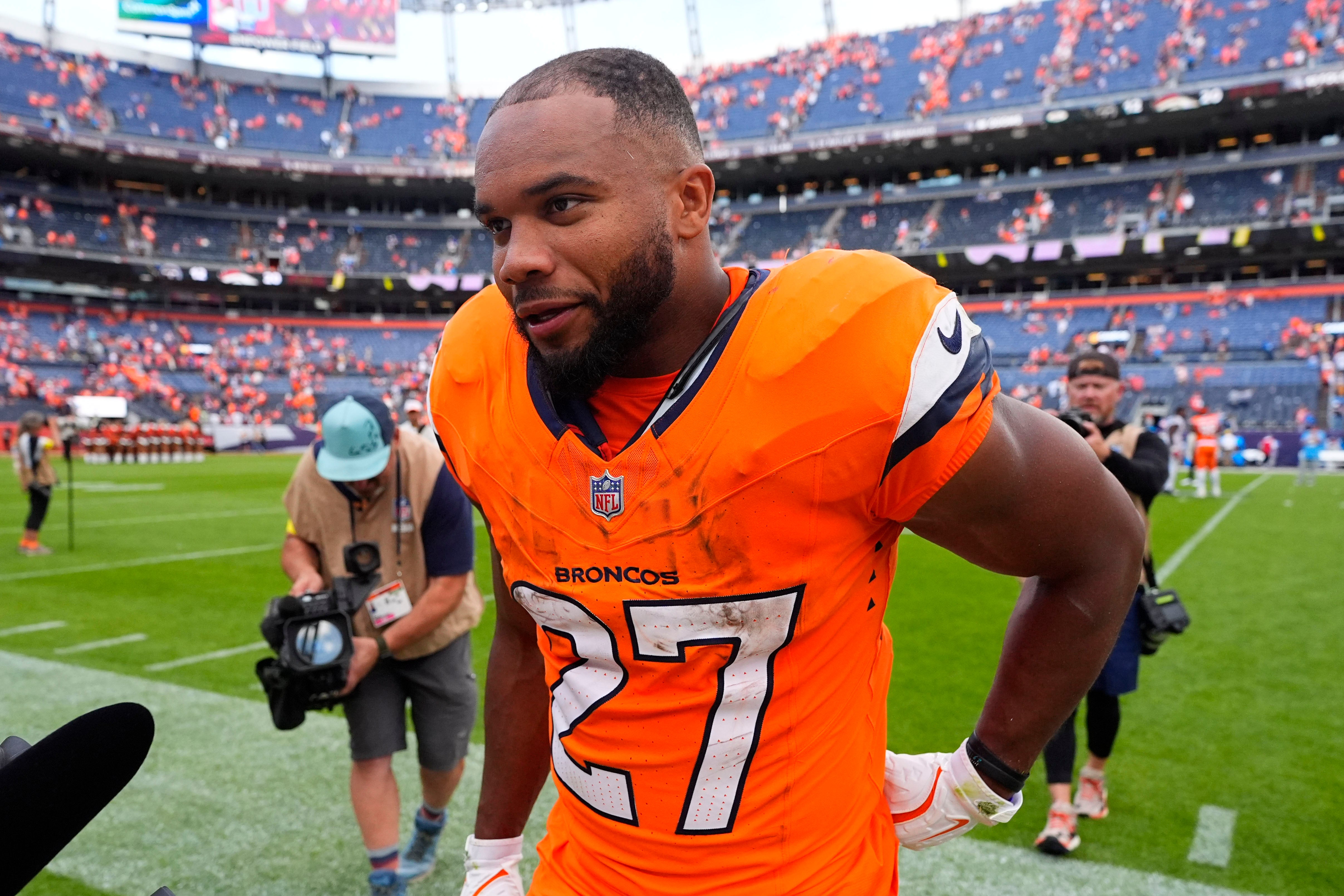 Sep 7, 2025; Denver, Colorado, USA; Denver Broncos running back J.K. Dobbins (27) after the game at Empower Field at Mile High.