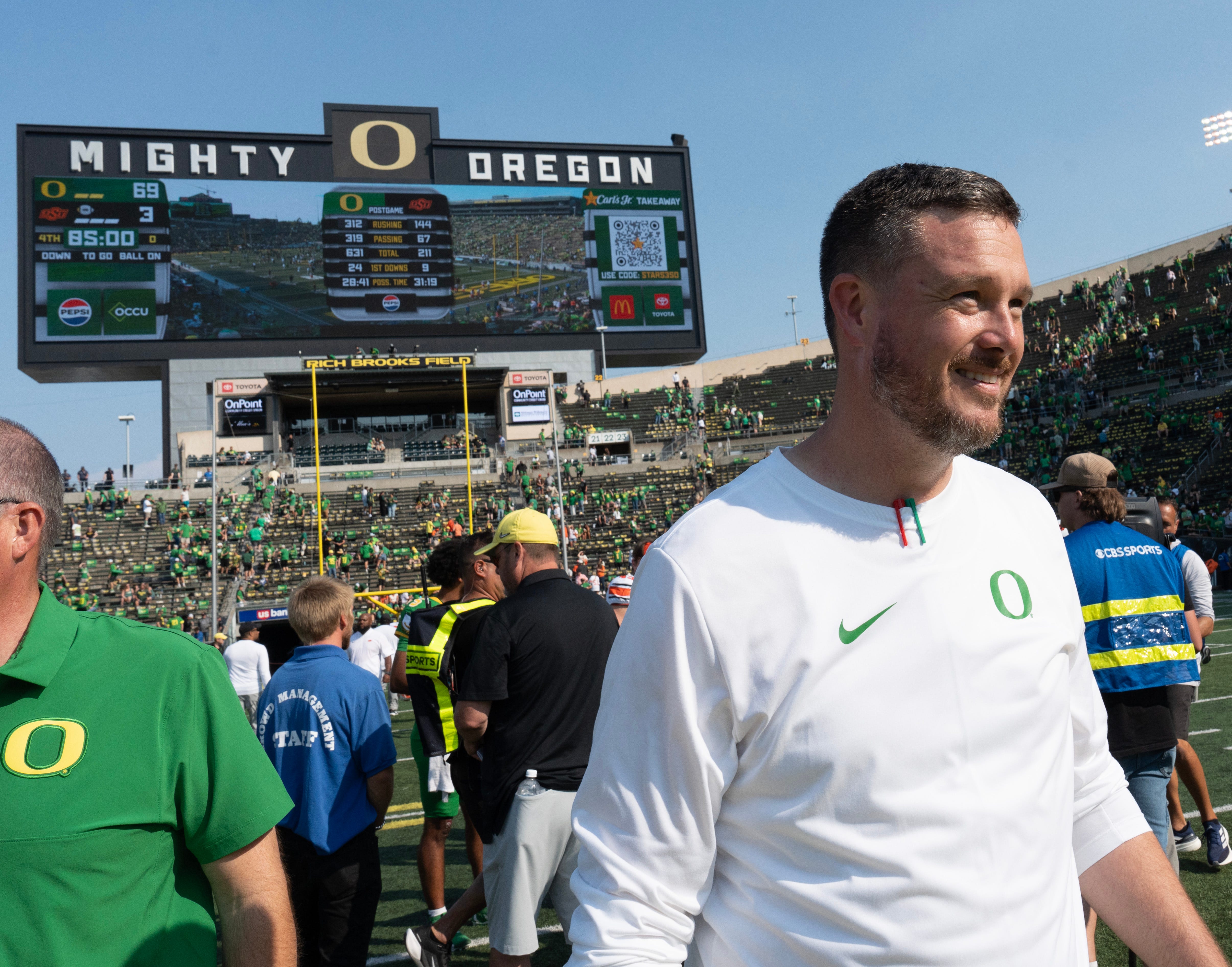 Oregon Head Coach Dan Lanning leaves the field after the win over Oklahoma State at Autzen.