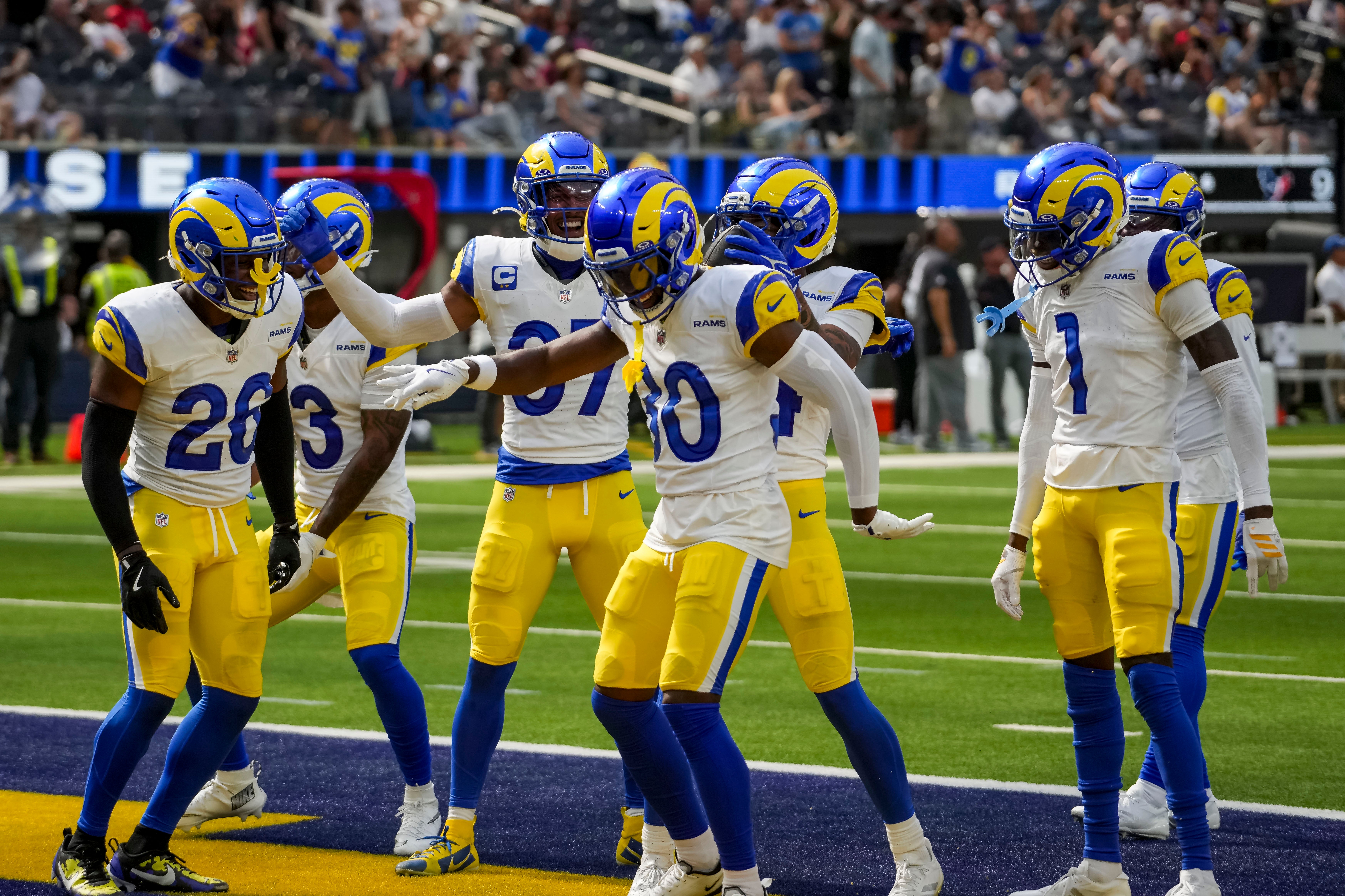 Rams celebrate an interception