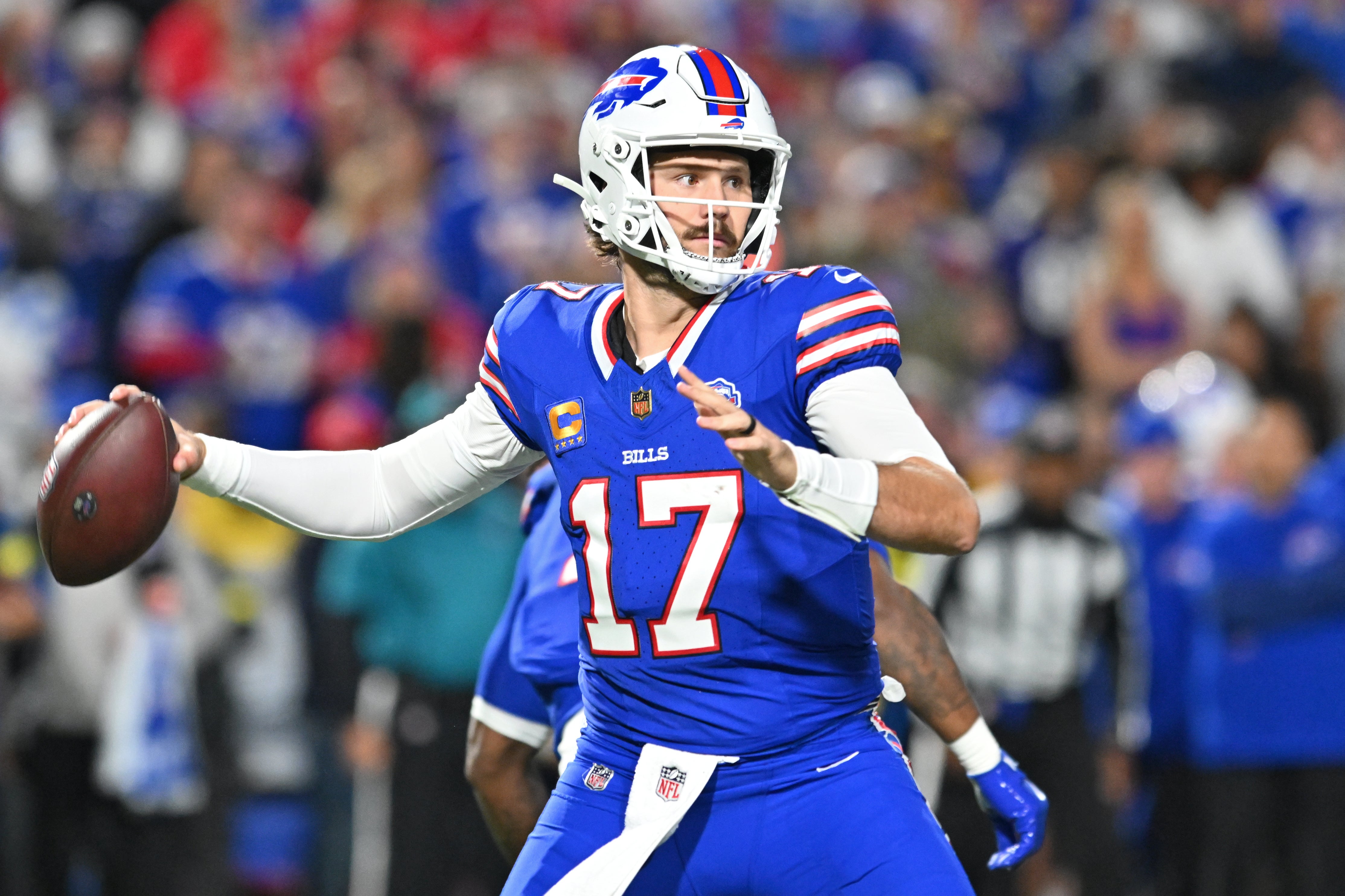 Sep 7, 2025; Orchard Park, New York, USA; Buffalo Bills quarterback Josh Allen (17) passes the ball against the Baltimore Ravens during the first half at Highmark Stadium.