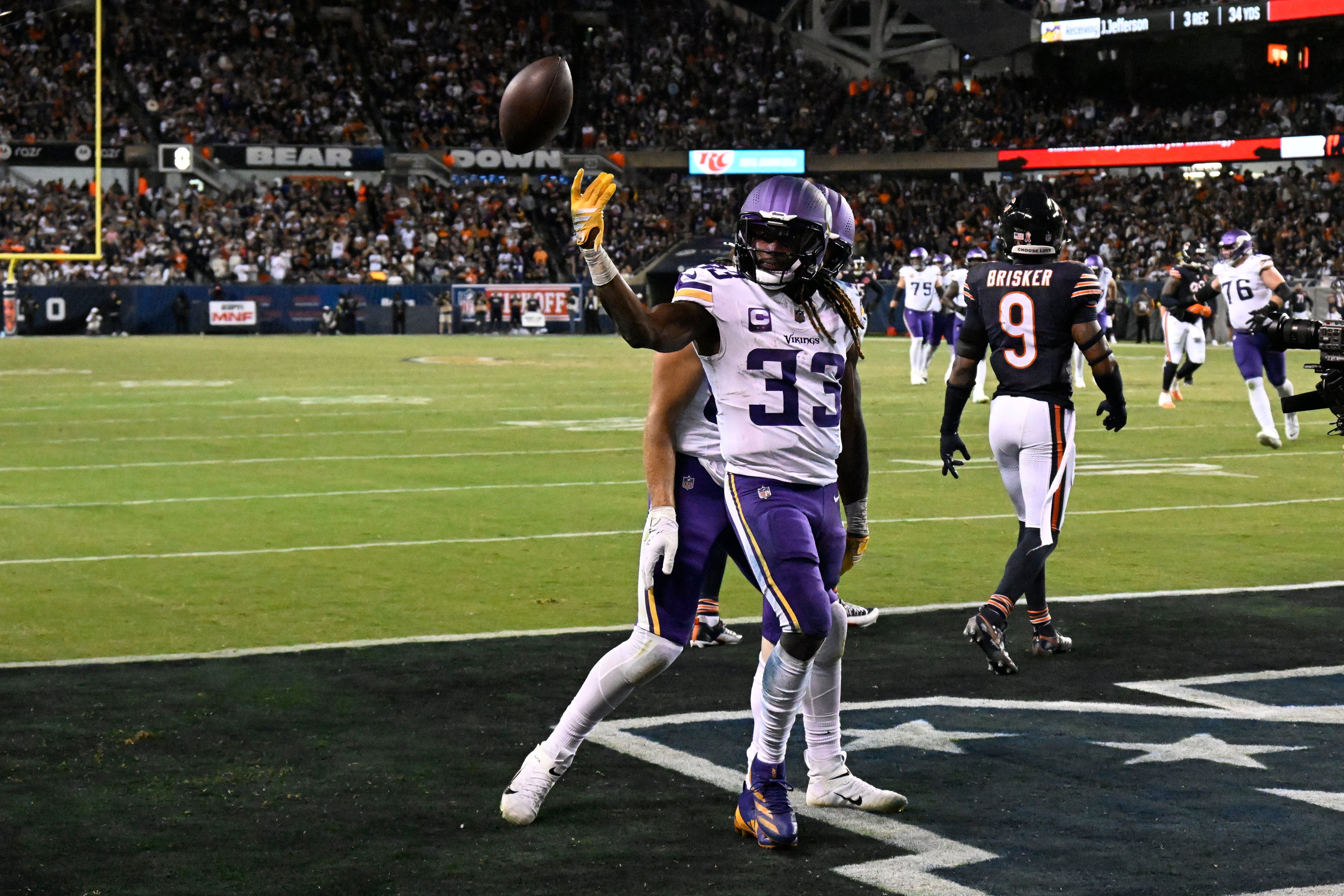 Sep 8, 2025; Chicago, Illinois, USA; Minnesota Vikings running back Aaron Jones Sr. (33) reacts after a touchdown against the Chicago Bears during the second half at Soldier Field.